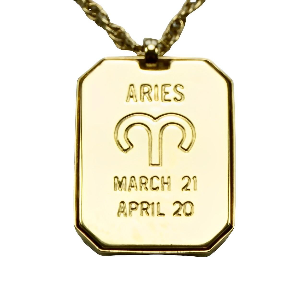 Pierre Cardin textured and shiny gold tone Aries zodiac pendant hanging on a lovely Prince of Wales chain. The pendant is designed with a ram and stars, the main star is set with a diamond. It has the original Pierre Cardin tag. 

The pendant