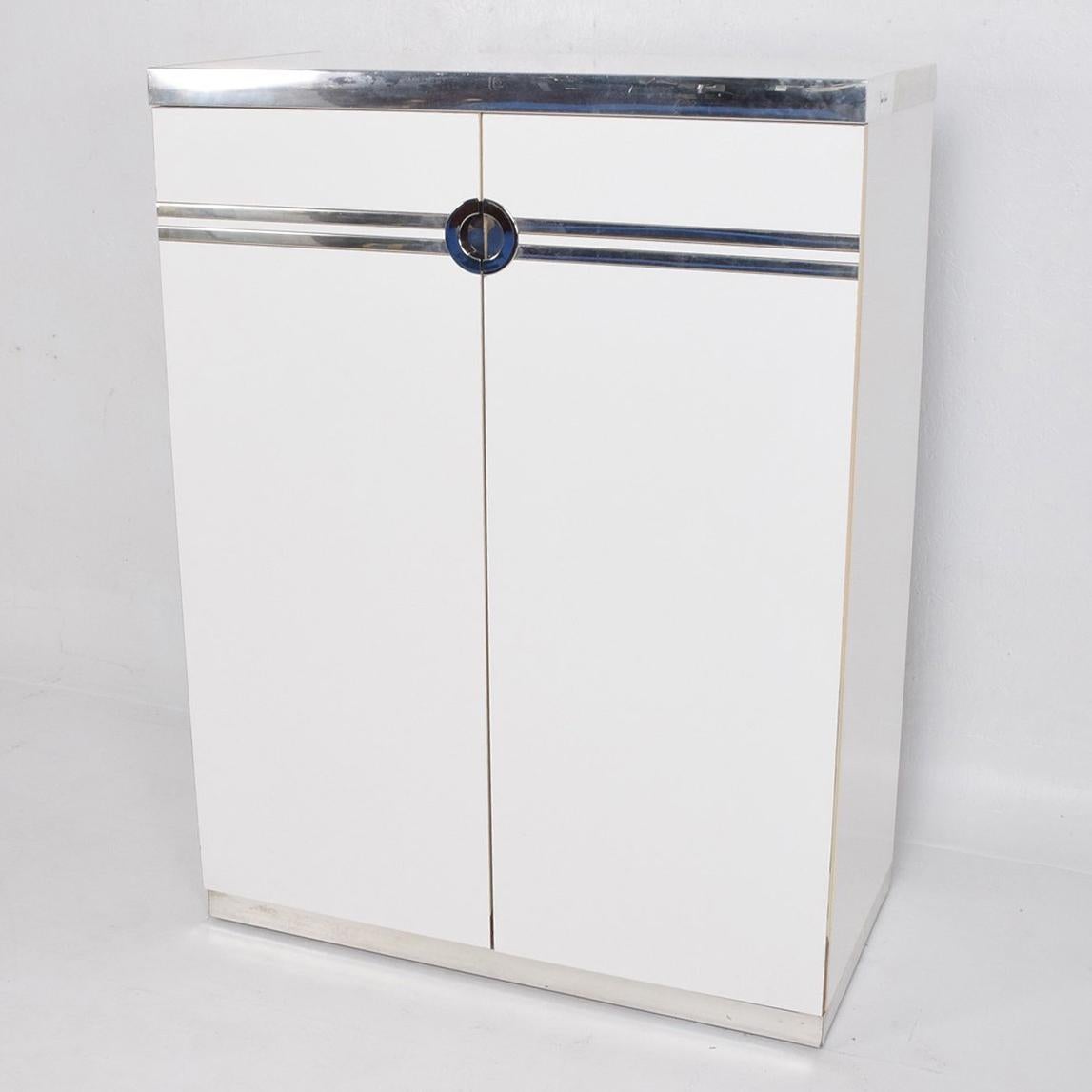 For your consideration a vintage Pierre Cardin highboy or chest of drawers made in formica, wood, aluminium and chrome-plated accents. 

I have a bedroom set available in another posting. 

All drawers open and close with ease. Signed Pierre