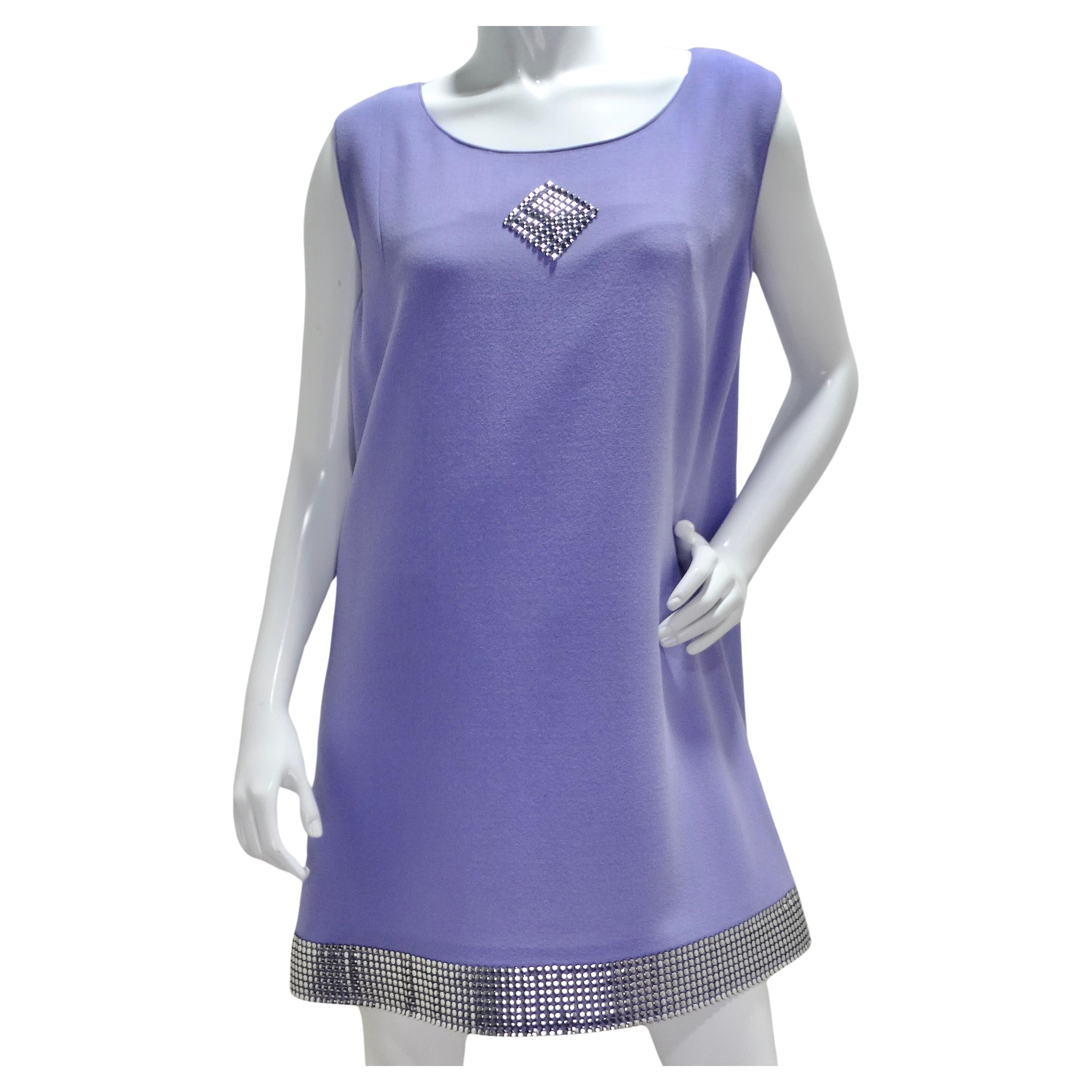 Introducing the Pierre Cardin Lavender Studded Dress, a vibrant and bold statement piece that exudes modern elegance with a vintage-inspired twist. This classic straight-cut mid-length dress in a stunning shade of purple is a true showstopper,