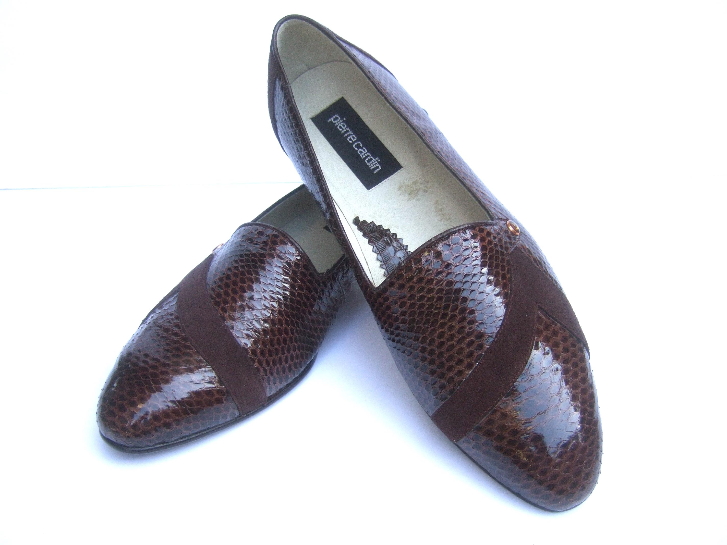 Pierre Cardin men's exotic brown snakeskin dress shoes New Vintage US Size 11 (Vintage Size) 
The stylish men's slip-on shoes are constructed with glossy brown snakeskin juxtaposed with bands of brown suede on the front & a panel on the back