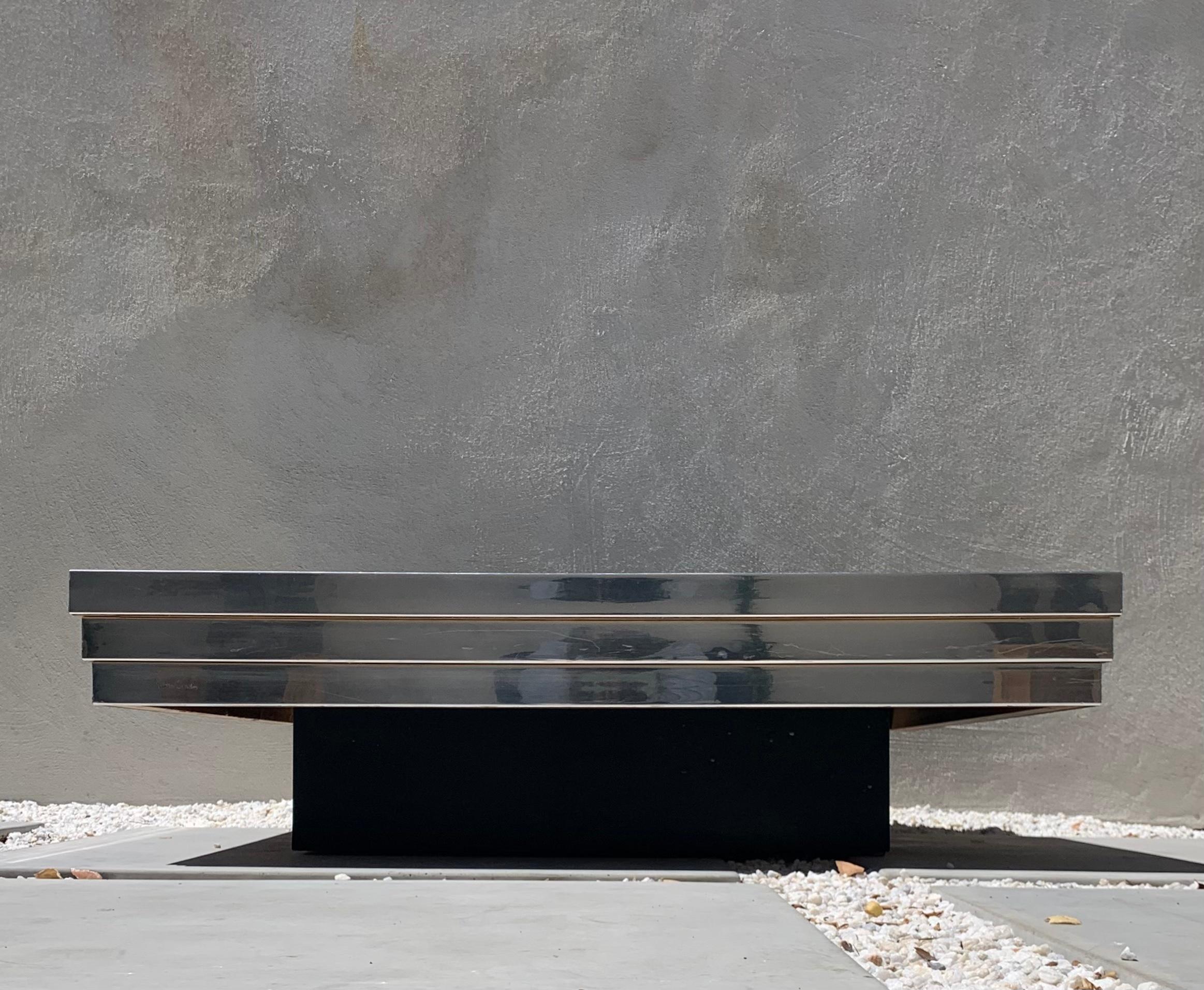 Et voila: Pierre Cardin coffee table with ebonized wooden base and graduated aluminum top, circa early 1970s. Signed by Le Monsieur himself (see photos). Square inset to hold perhaps a statement floral or ~of course~ only the finest of champagnes.