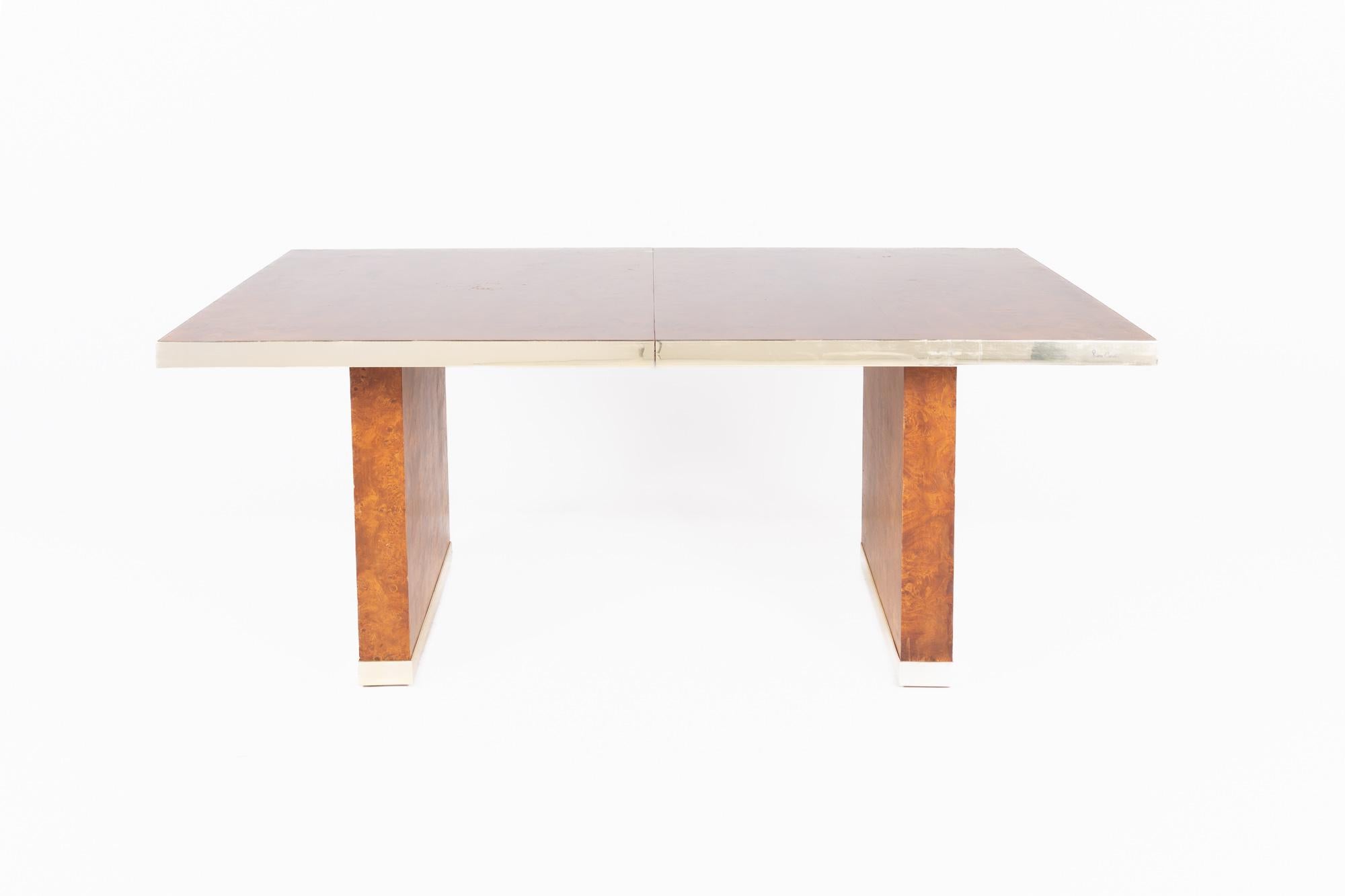 Pierre Cardin mid century burlwood and brass dining table

This table measures: 72 wide x 38 deep x 29 high, with a chair clearance of 26.5 inches, each leaf measures 18 inches wide, making a maximum table width of 108 inches when both leaves are