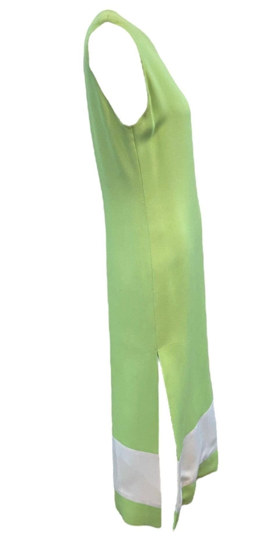This dress is a piece of fashion history. It is an authentic 1960s mod, color block maxi dress designed by one of the most iconic designers in history - Pierre Cardin. Lime green, aqua and white cotton blend. The dress features a classic op-art and