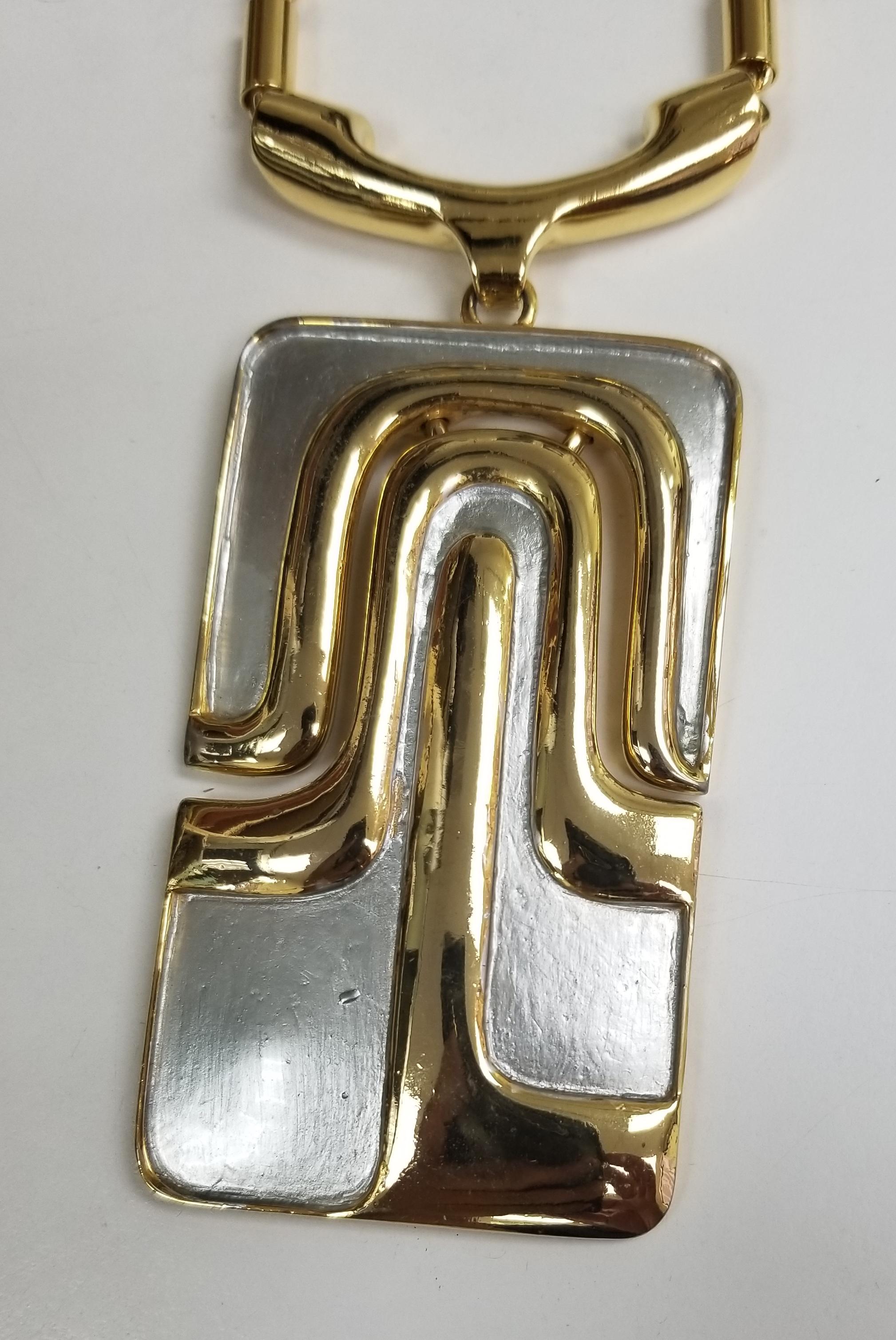Pierre Cardin vintage modern gold and white tone metal necklace.  Pendant measures almost 5
