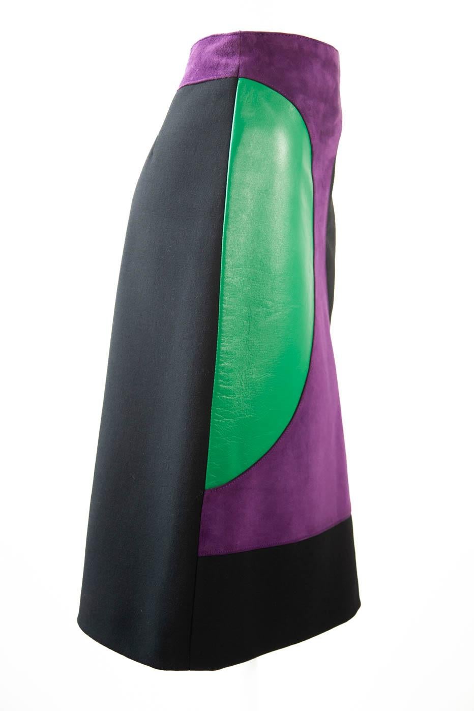 Pierre Cardin Space Age 1960's color block mod pattern purple suede, green leather, A-line skirt. Made of structured wool. Closes with a back zipper and is fully lined.