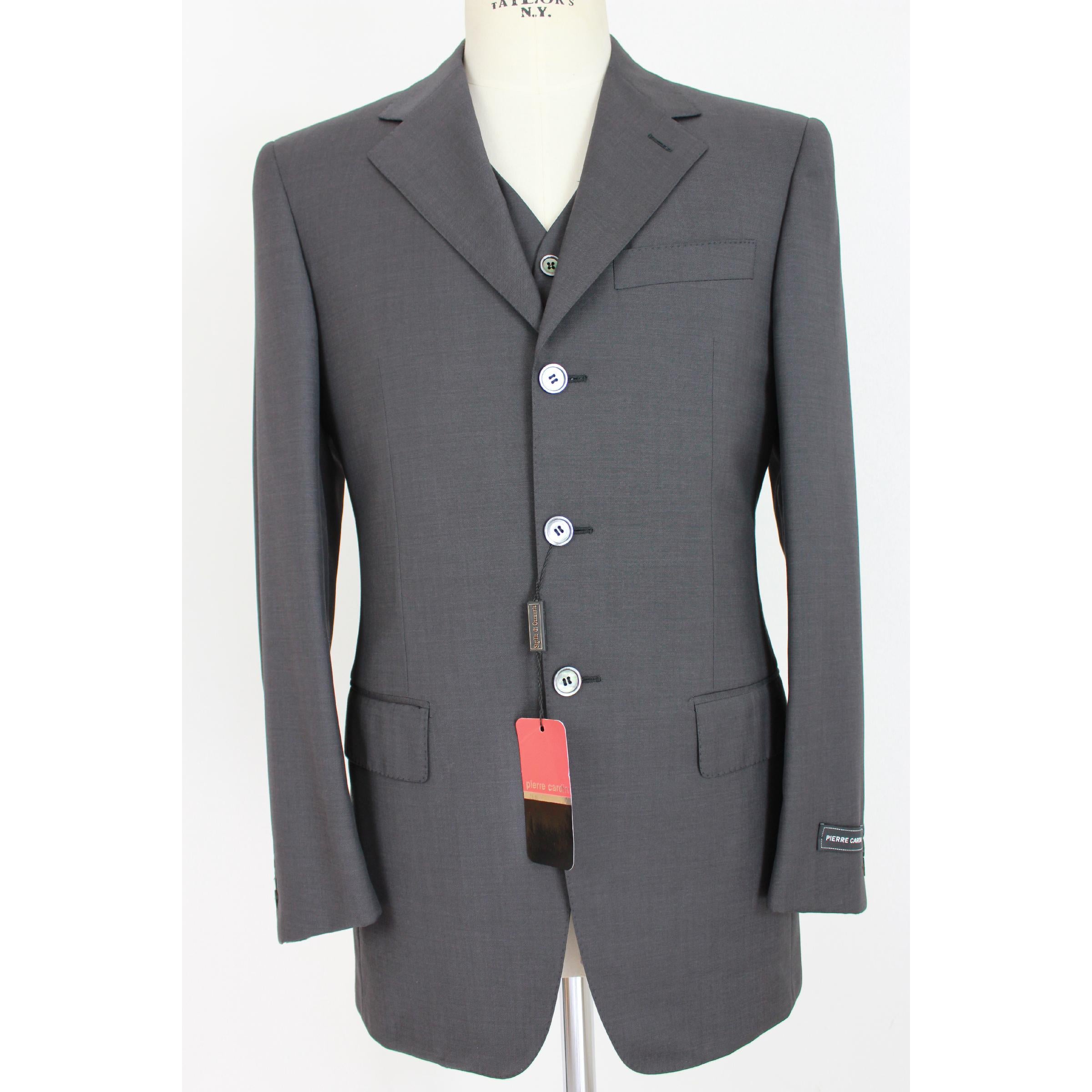 Pierre Cardin ceremony men's pant's suit. Three button complete, gray color, 100% Cerruti family superior wool. Mother of pearl buttons, 1990s. Made in Italy. New with tag. 

Size: 46 It 36 Us 36 Uk 

Shoulder: 46 cm 
Bust / Chest: 52 cm 
Sleeve: 62