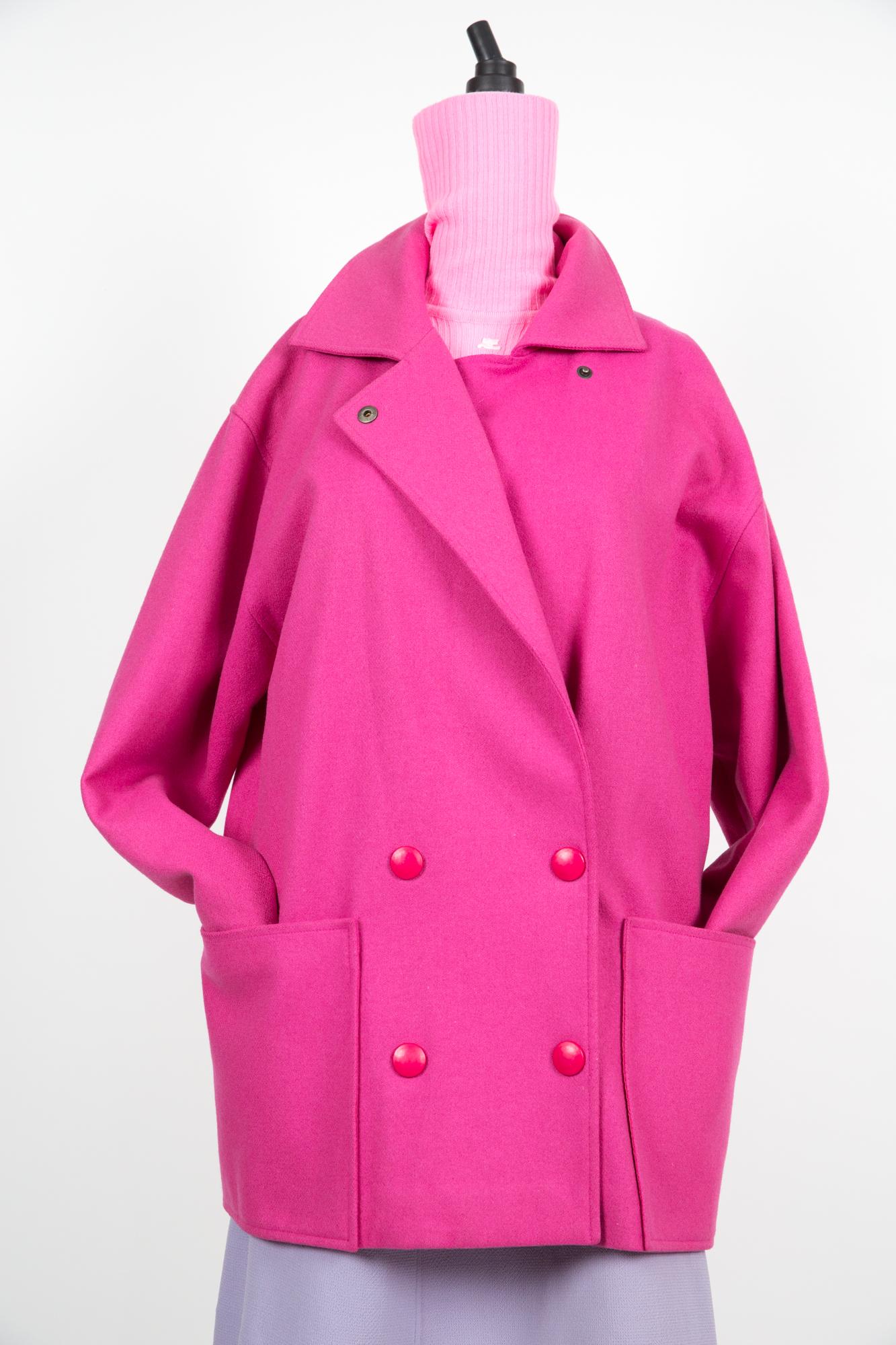 Pierre Cardin pink wool coat featuring a shocking pink color,  cocoon oversized shape, snaps opening, large front pockets and a full lining. 
Circa: 1980s
Virgin wool 95%
Polyamide 5%
In good vintage condition. Made in France.
( some small holes