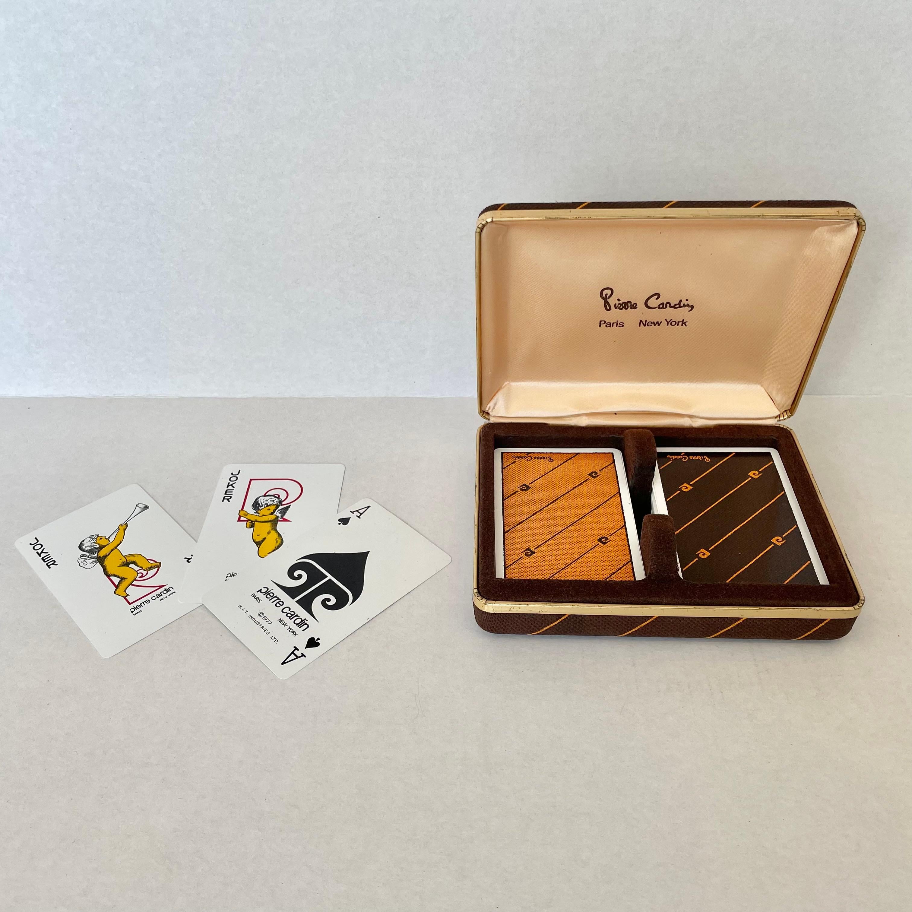 Original 1970s Pierre Cardin plastic playing cards in a fabric case. Elegance and style that is common with the major fashion house and the late Pierre Cardin make these cards a major statement and a piece from the heyday of the House of Cardin.