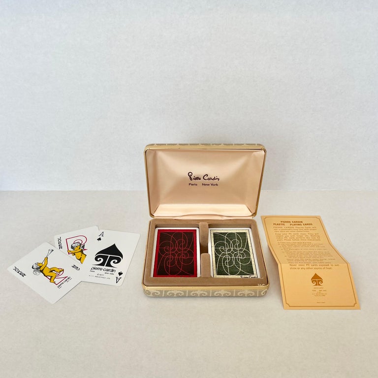Original 1970s Pierre Cardin playing cards in a fabric case. Elegance and style that is common with the major fashion house and the late Pierre Cardin make these cards a major statement and a piece from the heyday of the House of Cardin. Tan fabric
