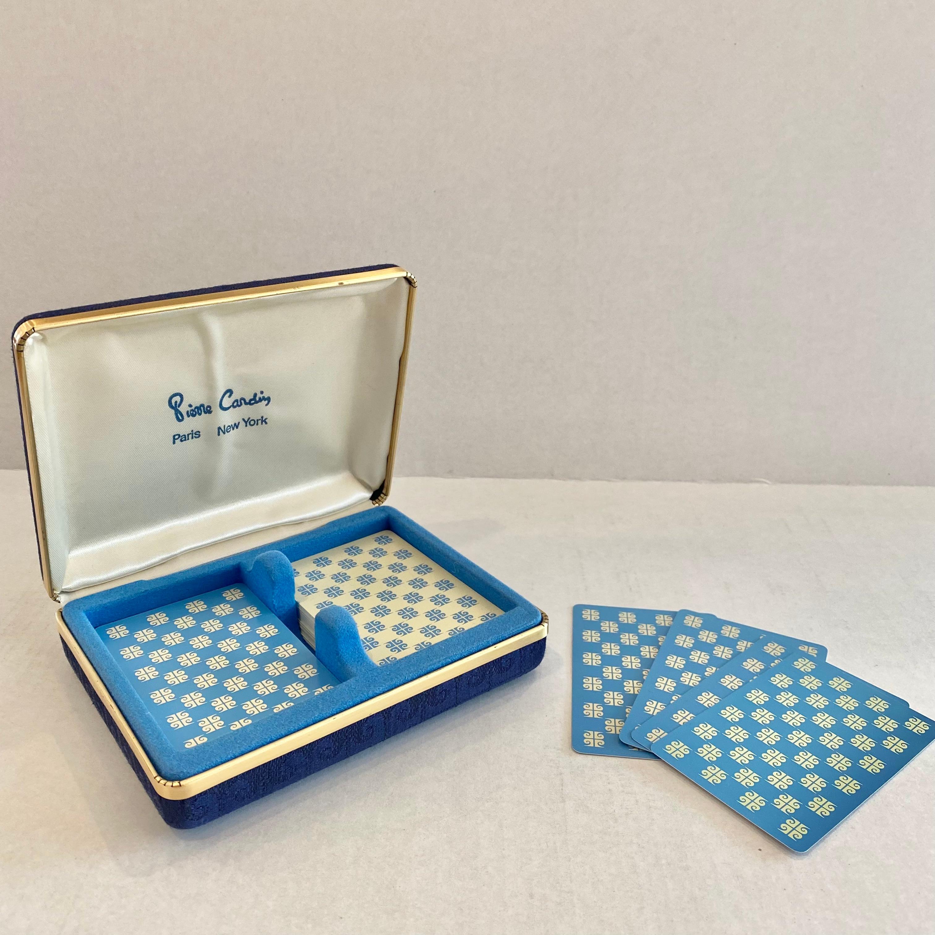 Original 1970s Pierre Cardin playing cards in a fabric case. Elegance and style that is common with the major fashion house and the late Pierre Cardin make these cards a major statement and a piece from the heyday of the House of Cardin. Blue fabric