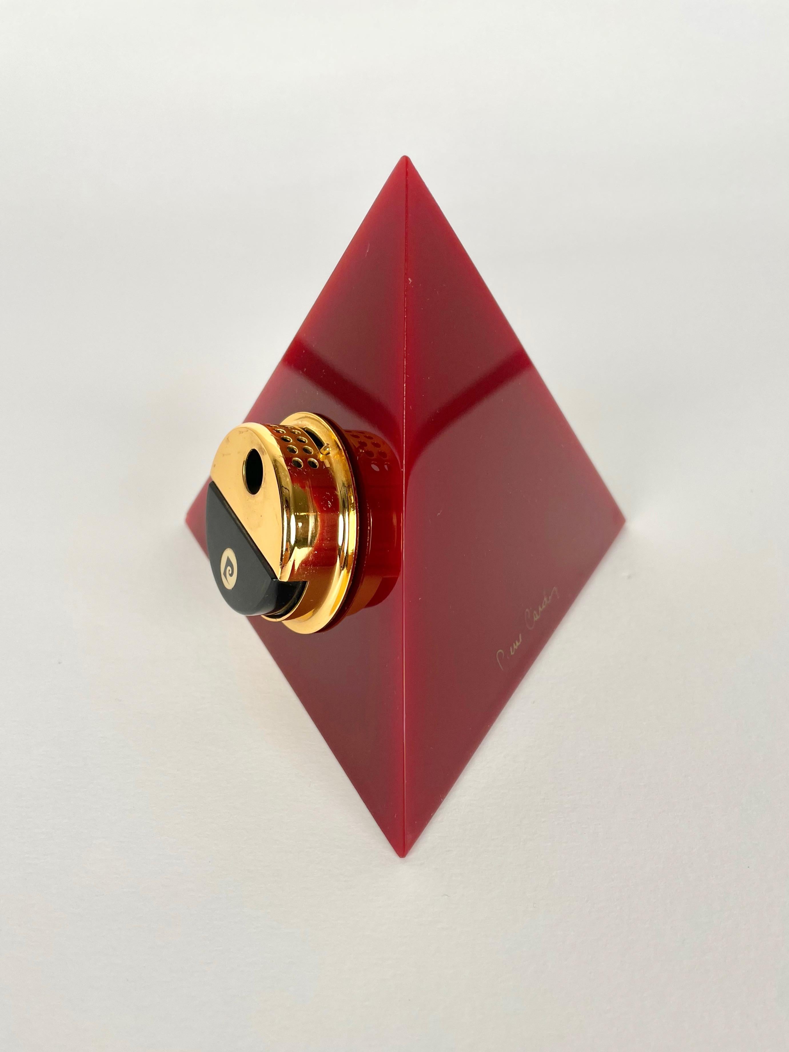 Pyramidal table lighter in bordeaux acrylic by Pierre Cardin (original signature still visible) made in France in the 1970s.