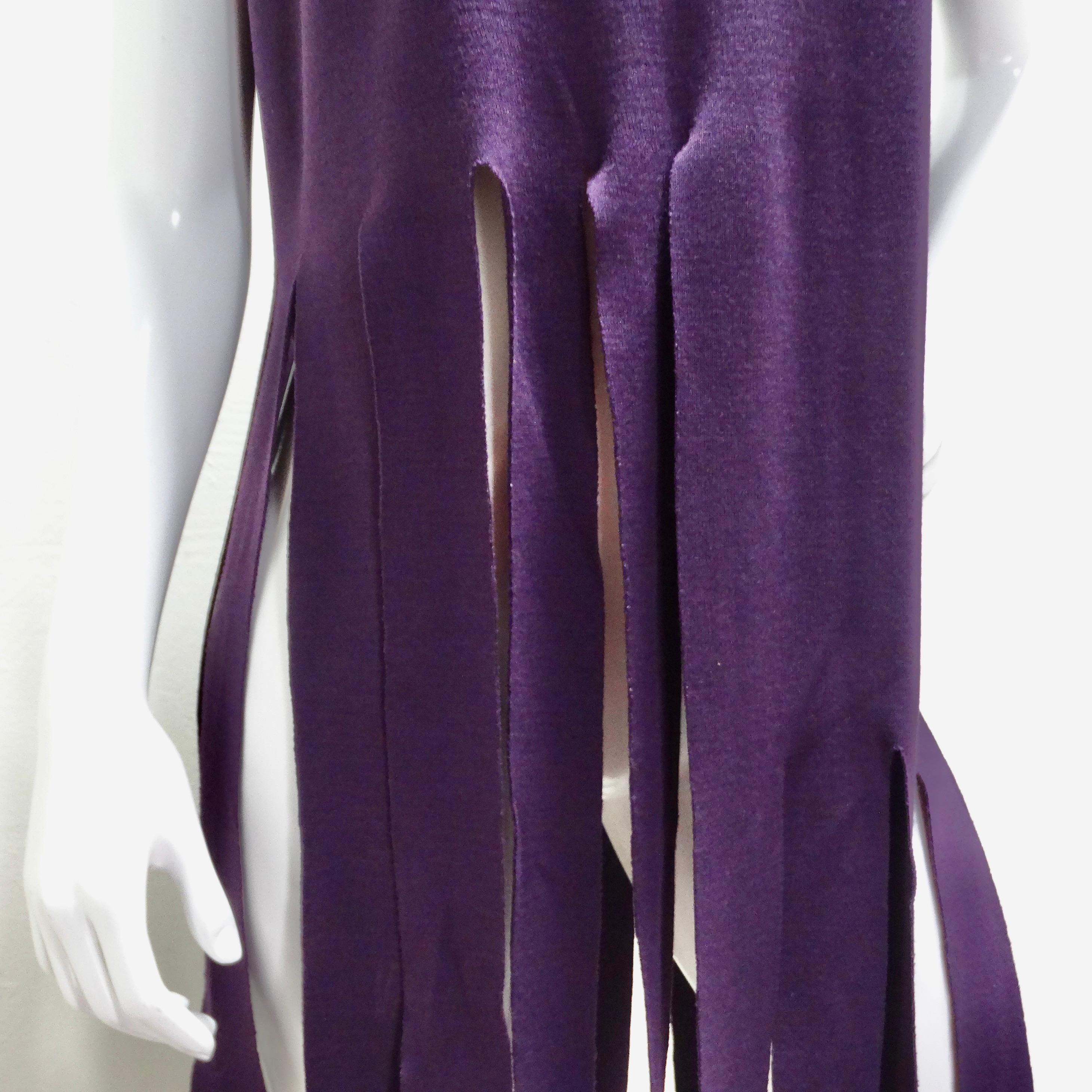 Introducing the Pierre Cardin Reissued Purple Fringe Top, a captivating and unique piece that exudes modern sophistication and avant-garde style. Crafted in a striking dark purple hue, this statement top is designed to make a bold impression.

The