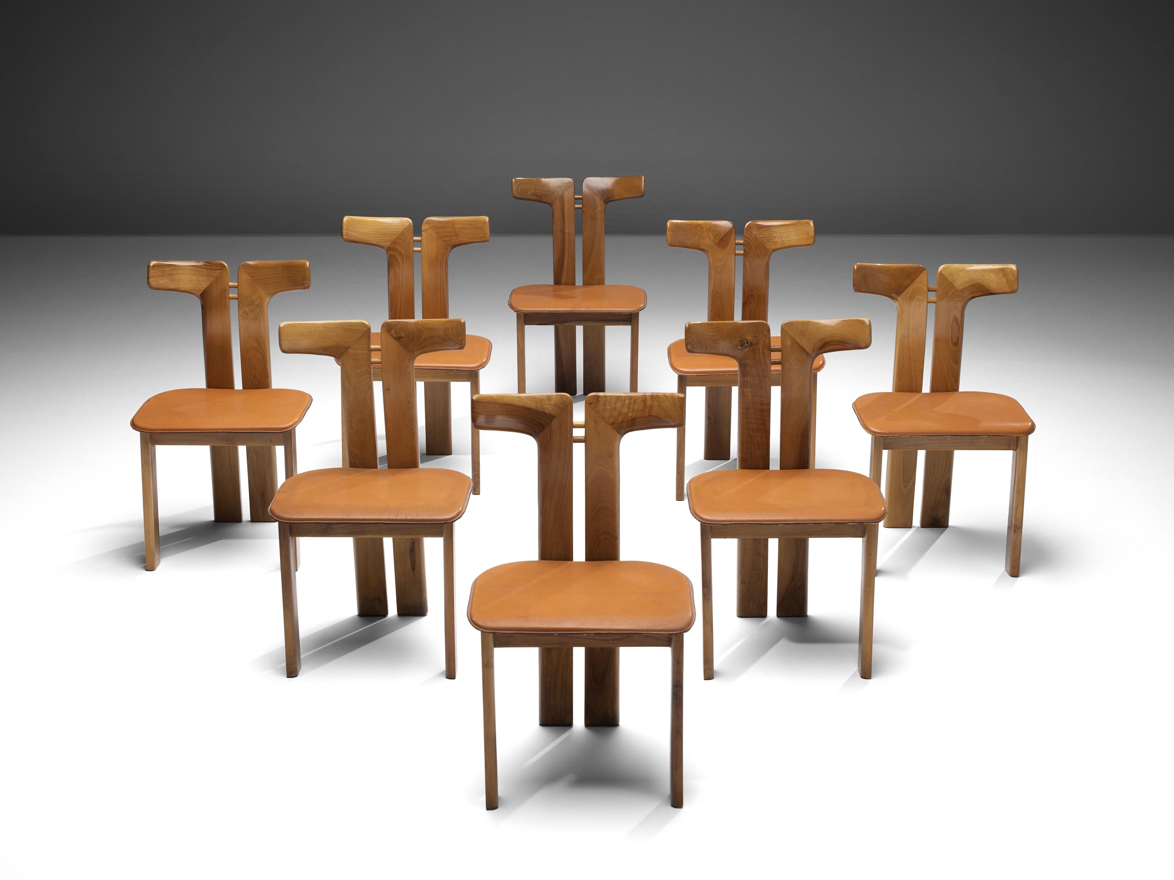 Pierre Cardin, set of eight dining chairs, walnut and cognac leather, Italy, 1980s 

This set of sculptural chairs is designed by Pierre Cardin. The curved back highlights the qualities of the wood and its shape in an unparalleled manner. These