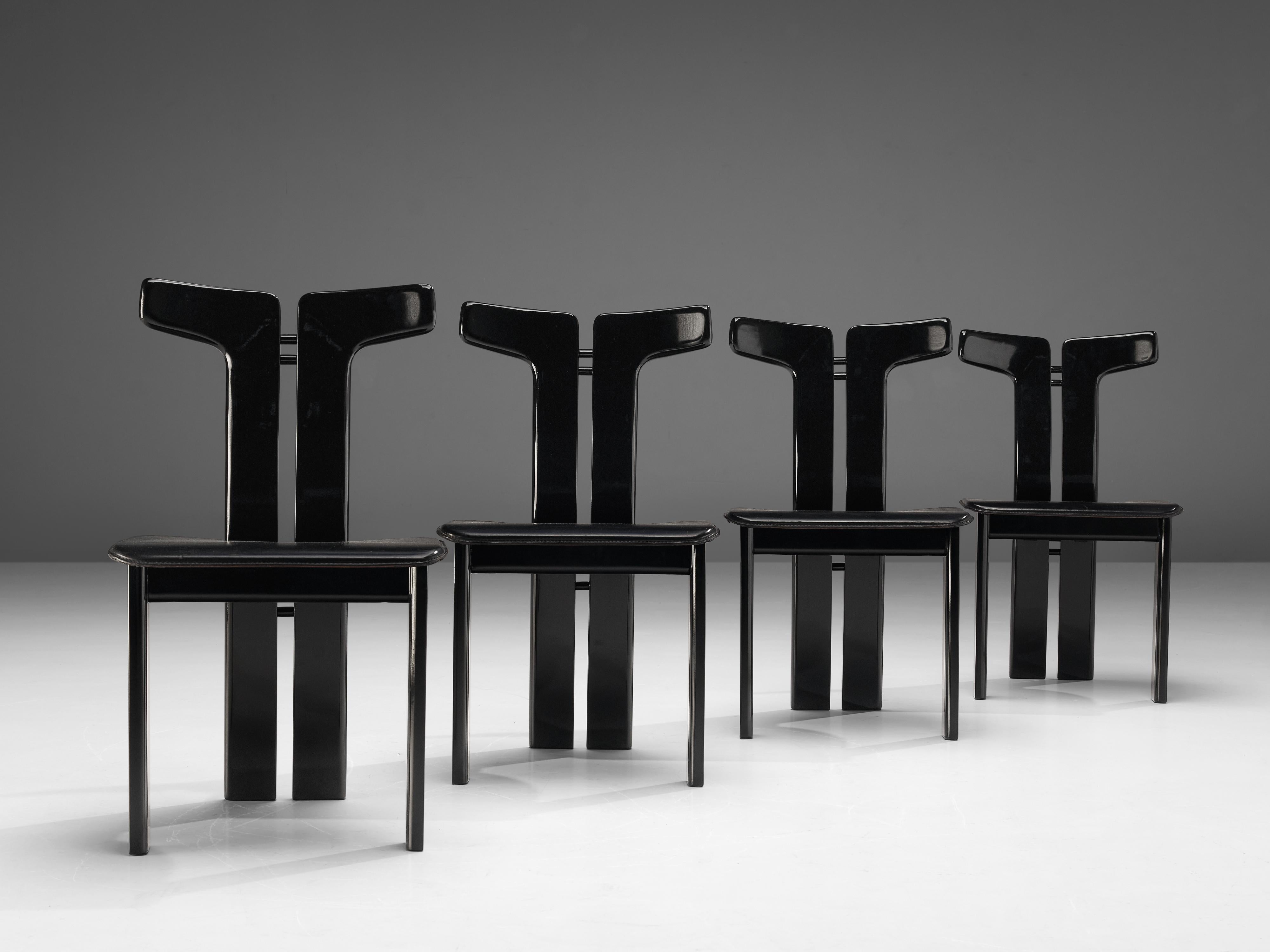 Pierre Cardin, dining chairs, lacquered wood, black leather, Italy, 1980s 

This set of sculptural chairs is designed by Pierre Cardin. The curved back highlights the qualities of the wood and its shape in an unparalleled manner. These organic