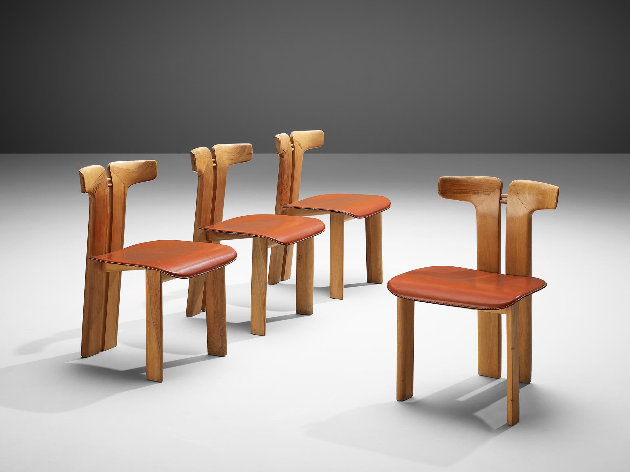 Pierre Cardin, set of four dining chairs, walnut and cognac leather, Italy, 1980s 

This set of sculptural chairs is designed by Pierre Cardin. The curved back highlights the qualities of the wood and its shape in an unparalleled manner. These