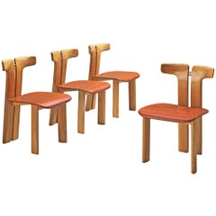 Pierre Cardin - Ensemble de quatre chaises de salle à manger en noyer et cuir cognac