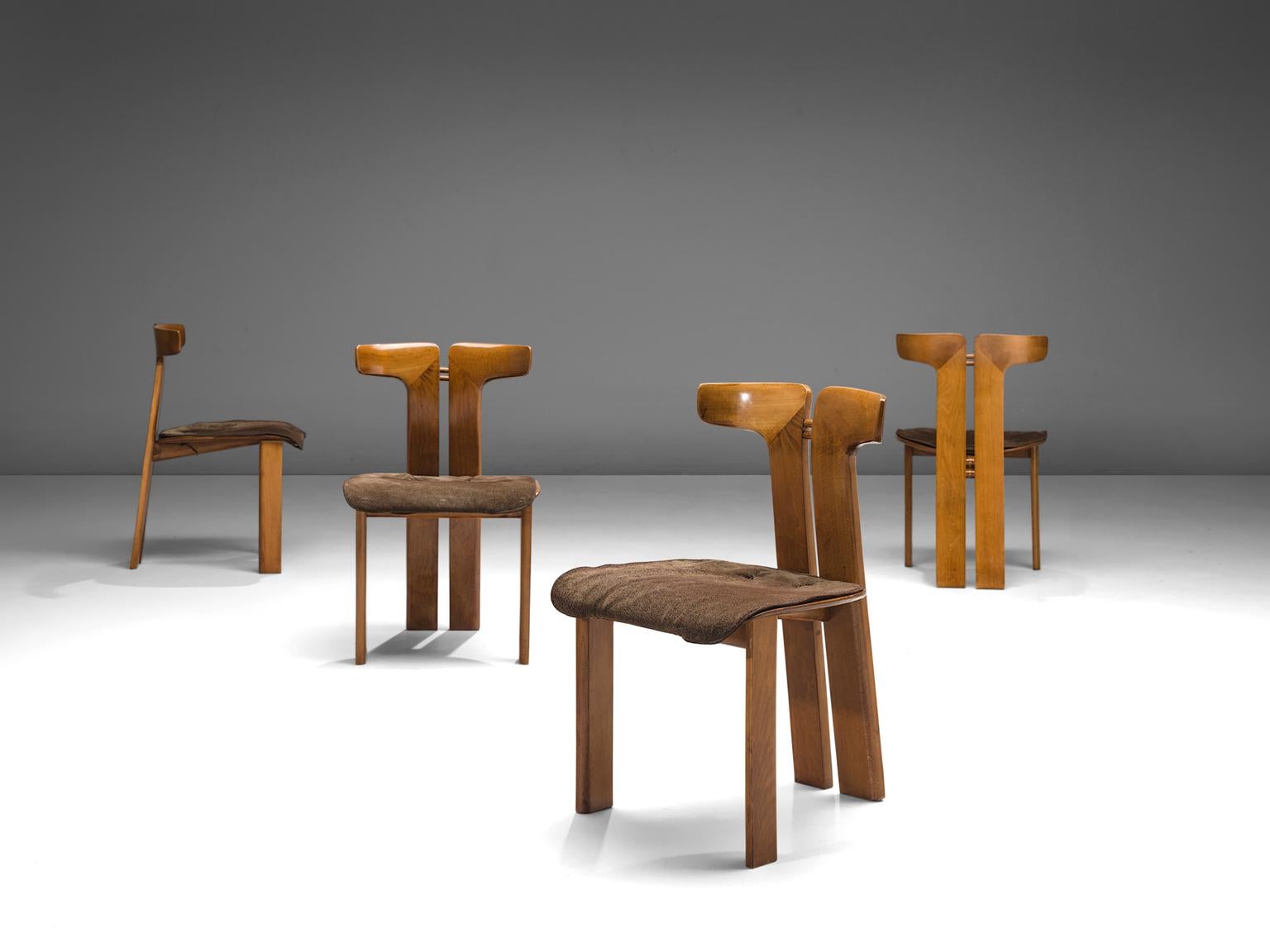 Pierre Cardin, set of four chairs, walnut and suede, Italy, 1980.

This set of sculptural chairs is designed by Pierre Cardin. The curve of the back highlights the qualities of the form of the wood in an unparalleled manner. These organic lines