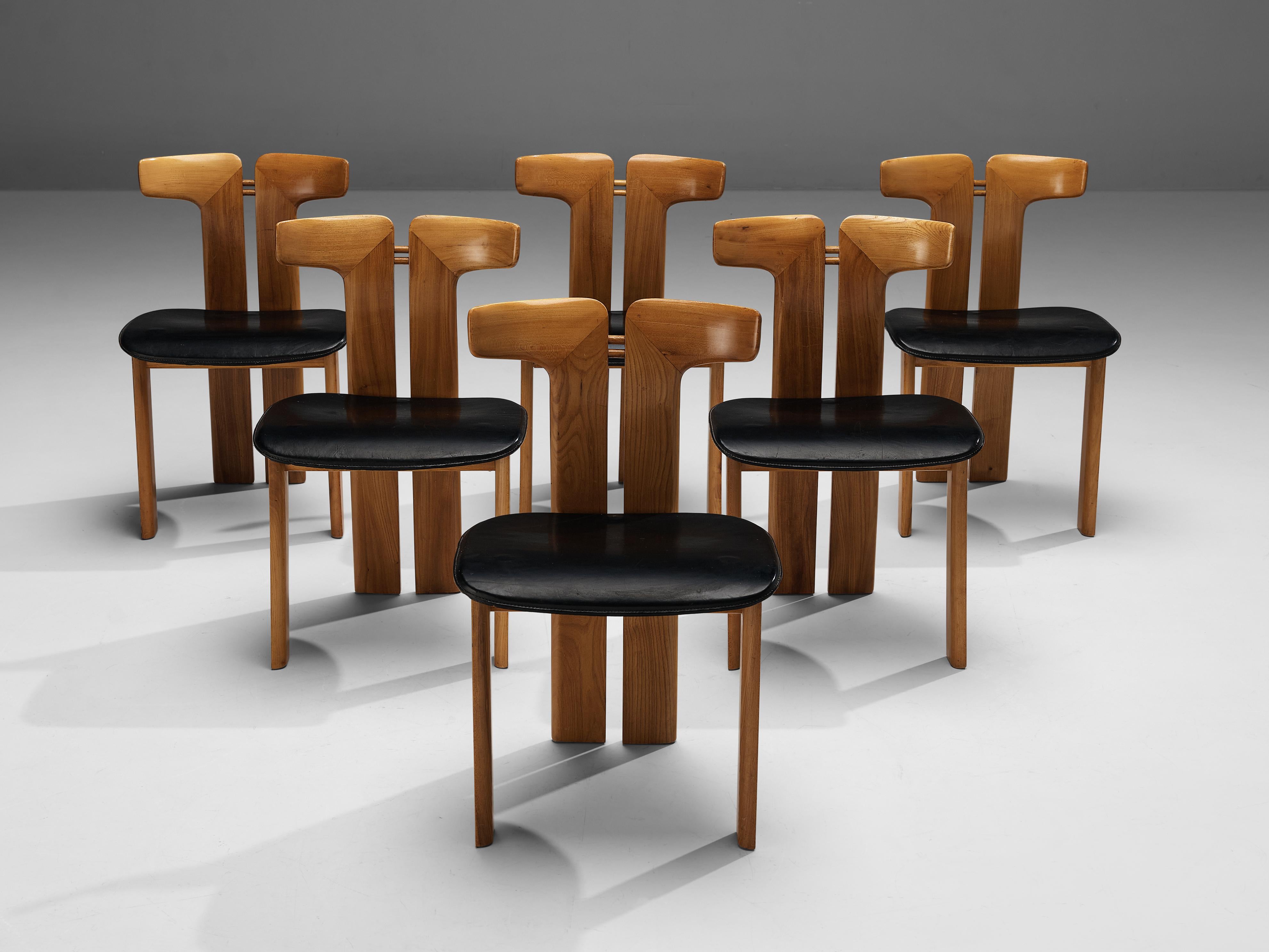 Pierre Cardin, dining chairs, walnut, black leather, Italy, 1980s 

This set of sculptural chairs is designed by Pierre Cardin. The curved back highlights the qualities of the wood and its shape in an unparalleled manner. These organic lines are