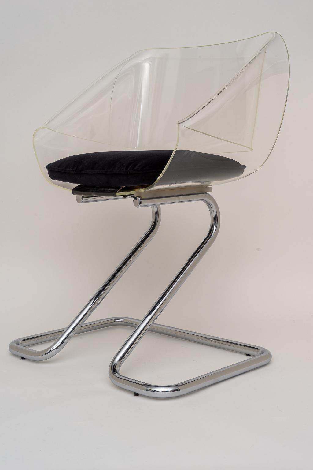This stylish 1970s arm chairs if very much in the hip style of pieces created by Pierre Cardin. The scale is perfect for a desk or vanity chair and of course as a pull up chair for any room.

Note: The lucite has been professionally polished