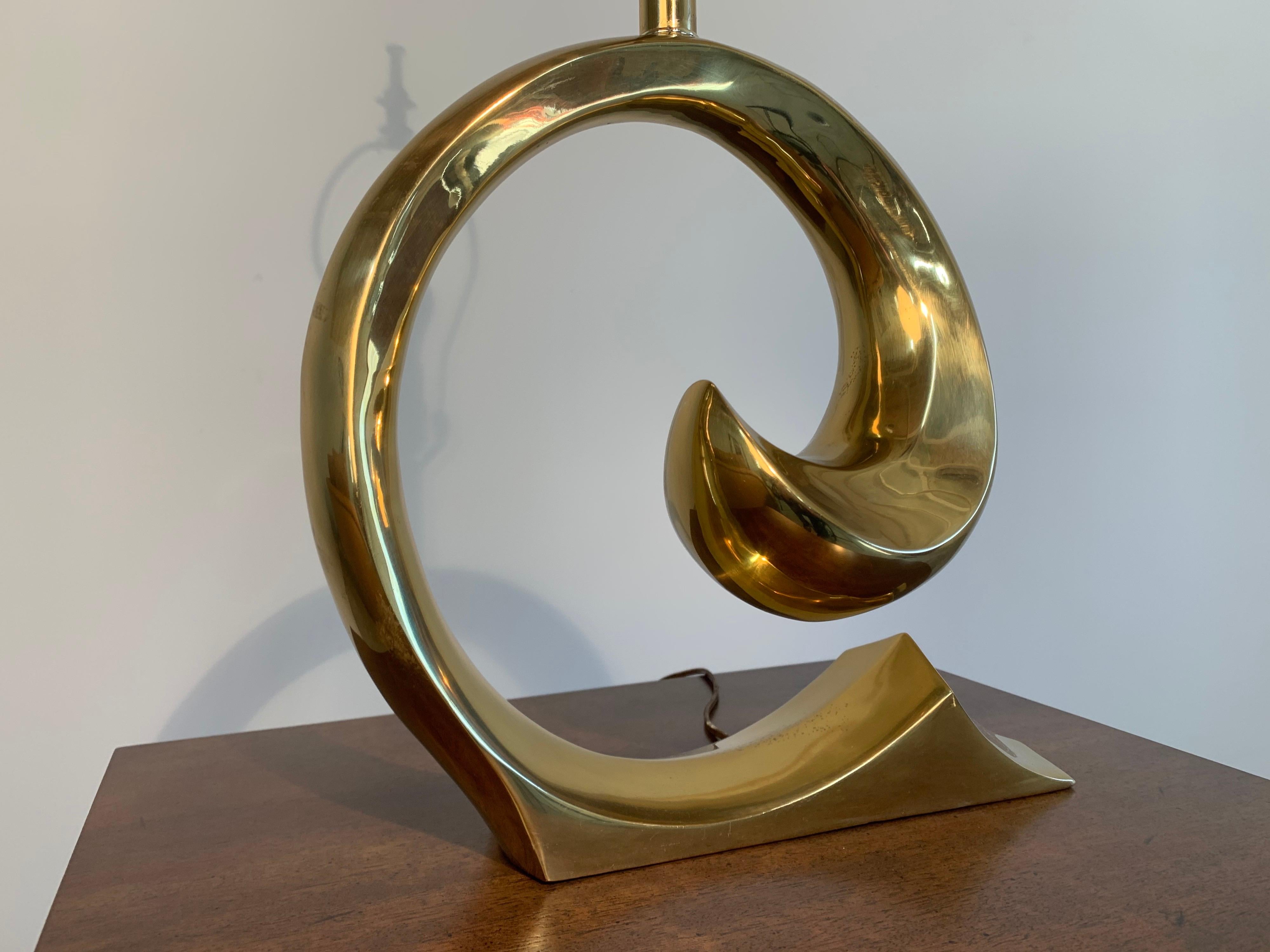Vintage Pierre Cardin “Swoosh” table lamp having gold tone finish.
Beautiful condition having been freshly polished. Wiring is tested as functional and safe.