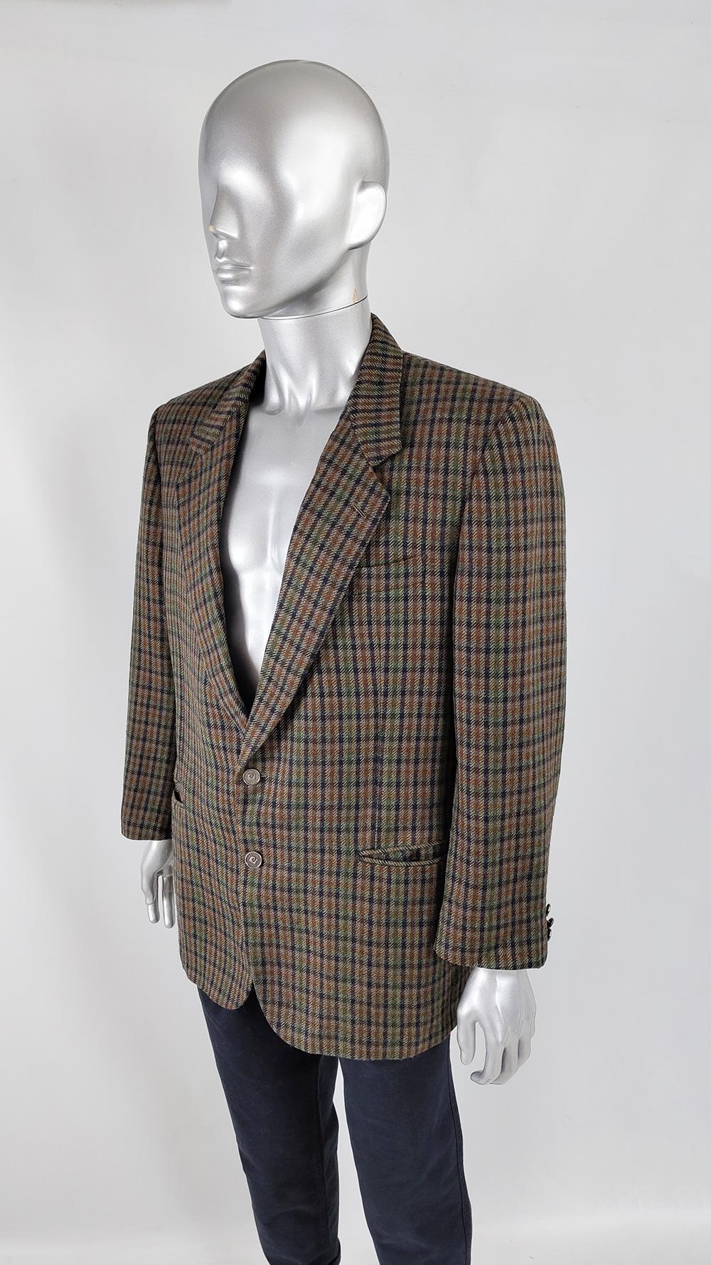 A stylish and rare vintage mens blazer from the 80s by luxury French fashion designer, Pierre Cardin. Made in Italy, from a pure new wool green, grey, brown and blue check tweed fabric. It has a classic, sophisticated cut with single breasted metal