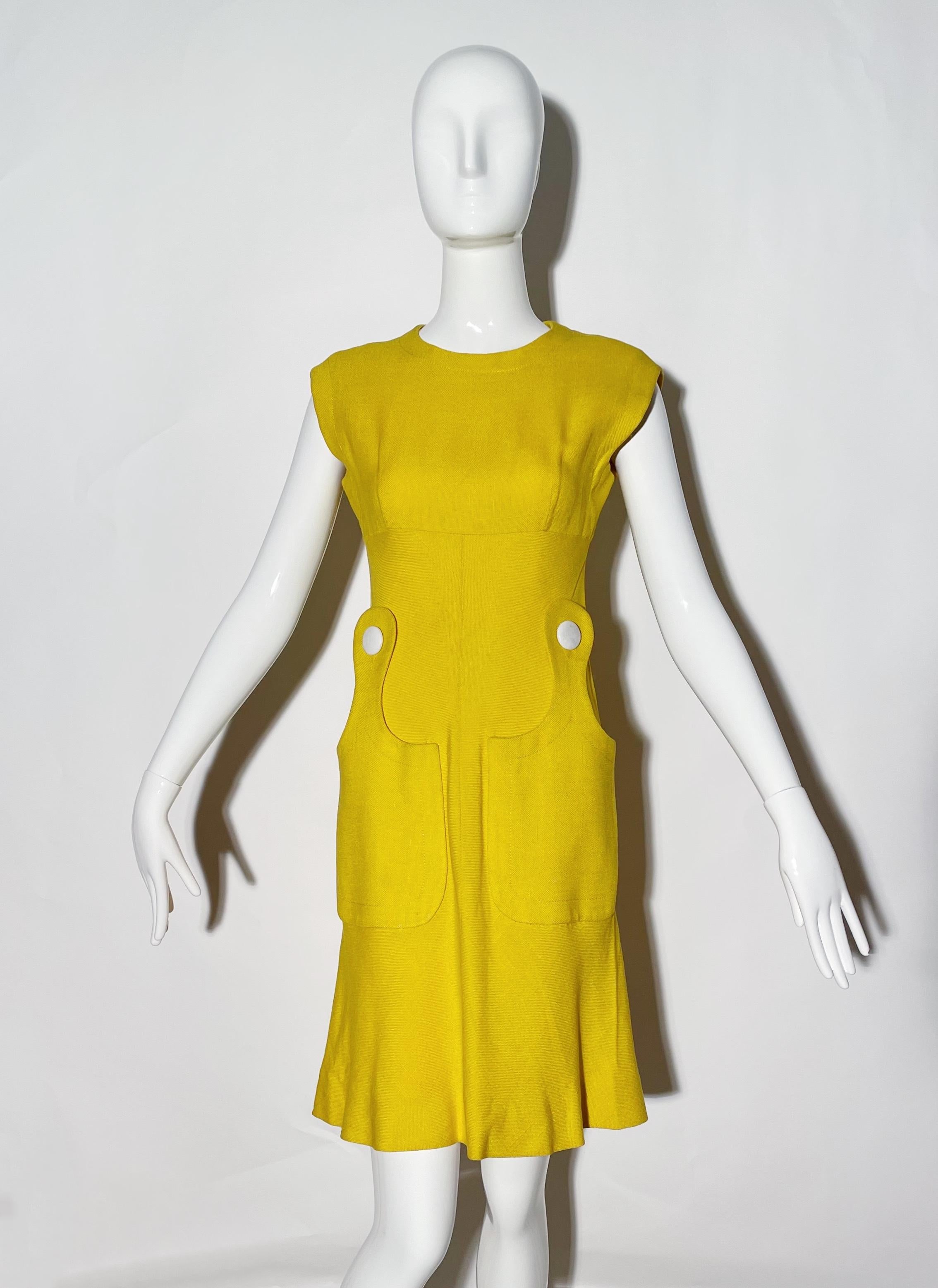 Yellow linen mod dress. Front pockets. Large white button details. Rear zipper closure. Lined. Made in France. 
*Condition: excellent vintage condition. No visible flaws.

Measurements Taken Laying Flat (inches)—
Shoulder to Shoulder: 17 in.
Bust: