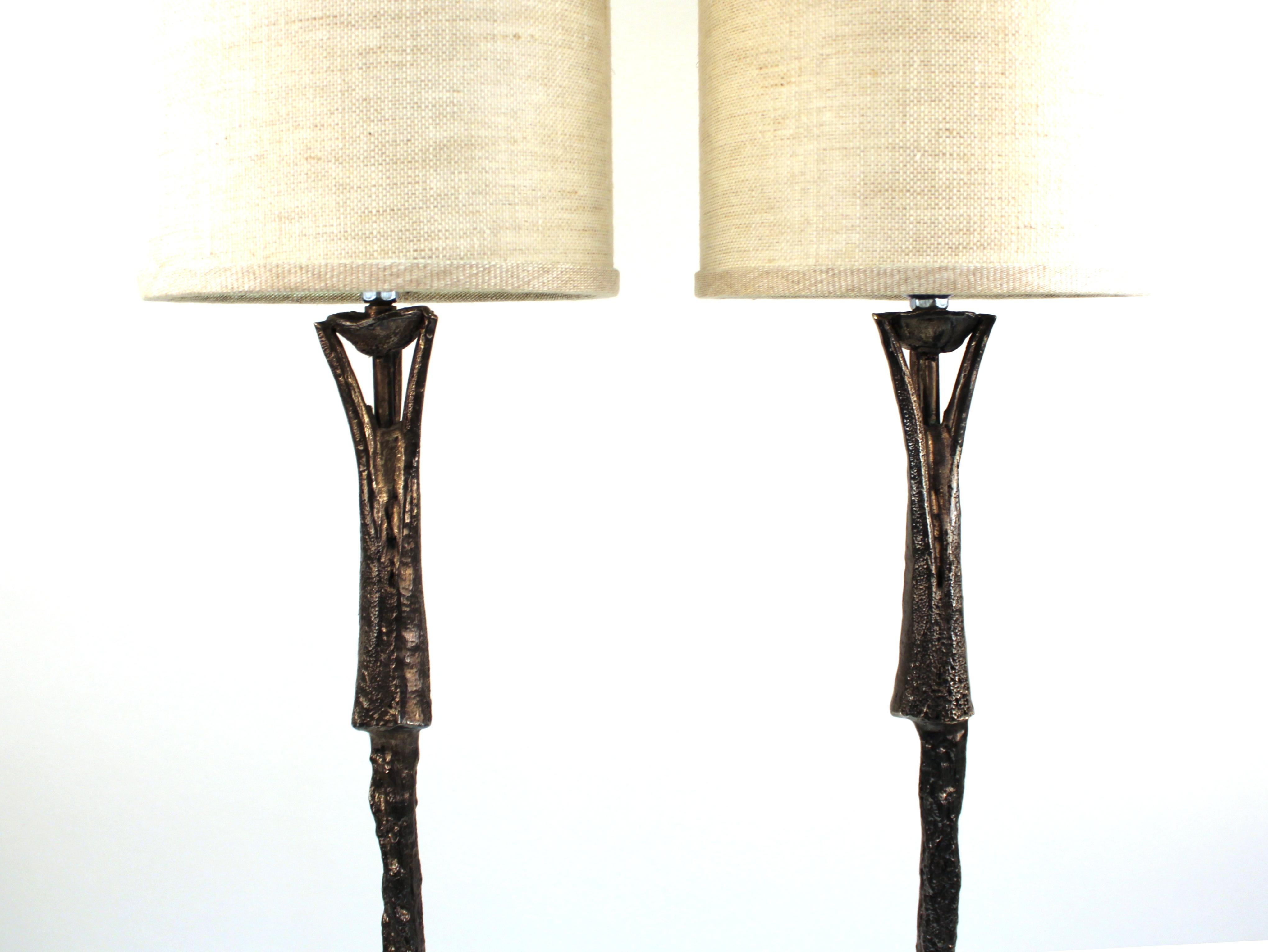 French modern pair of table lamps designed in bronze by Designer Pierre Casenove in the 1990s. The pair has signatures on the back of both bases and comes with the shades pictured. In great vintage condition with age-appropriate wear and use.