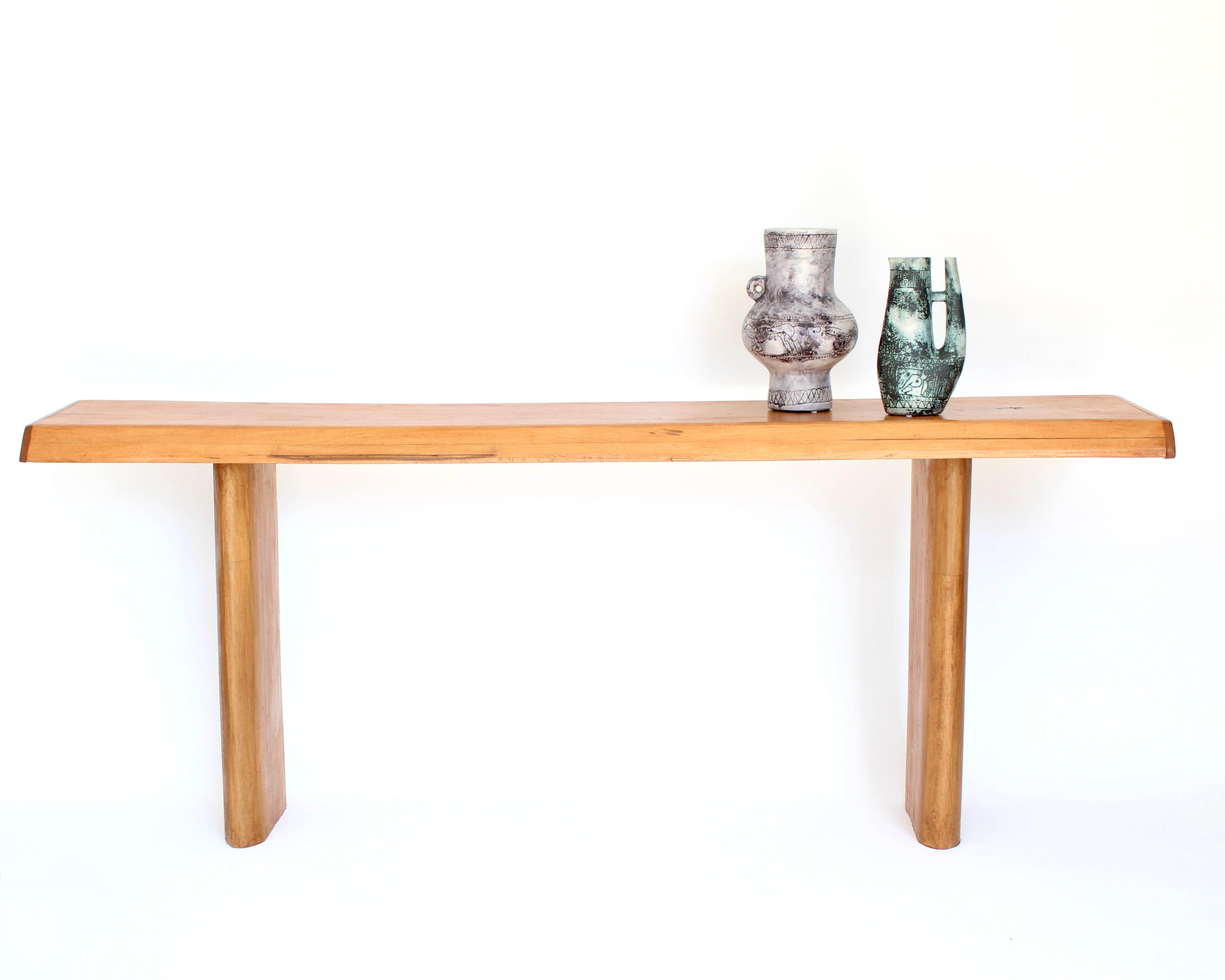 A massive French Elm wood console designed for Les Arcs ski resort Meribel France attributed to Pierre Chapo and most likely selected by Charlotte Perriand for Les Arcs. This console has massive wood legs in the style of Charlotte Perriand. The