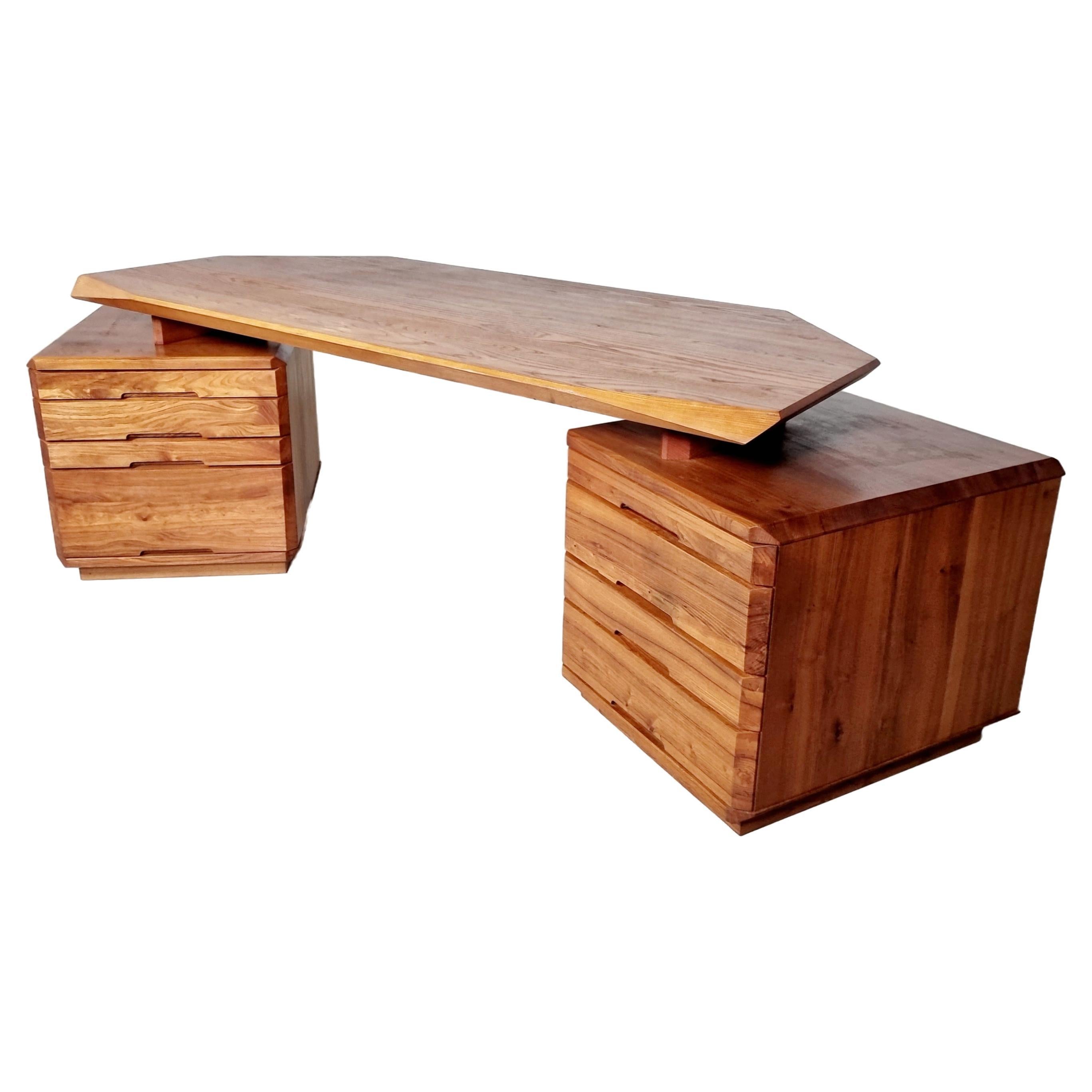 Pierre Chapo, B40 desk, solid elm, France, 1970s, 

Characteristic desk by French designer and carpenter Pierre Chapo. Eye-catching detail is the remarkable carved tabletop, with slanted sides and corners. This extraordinary desk is carved from