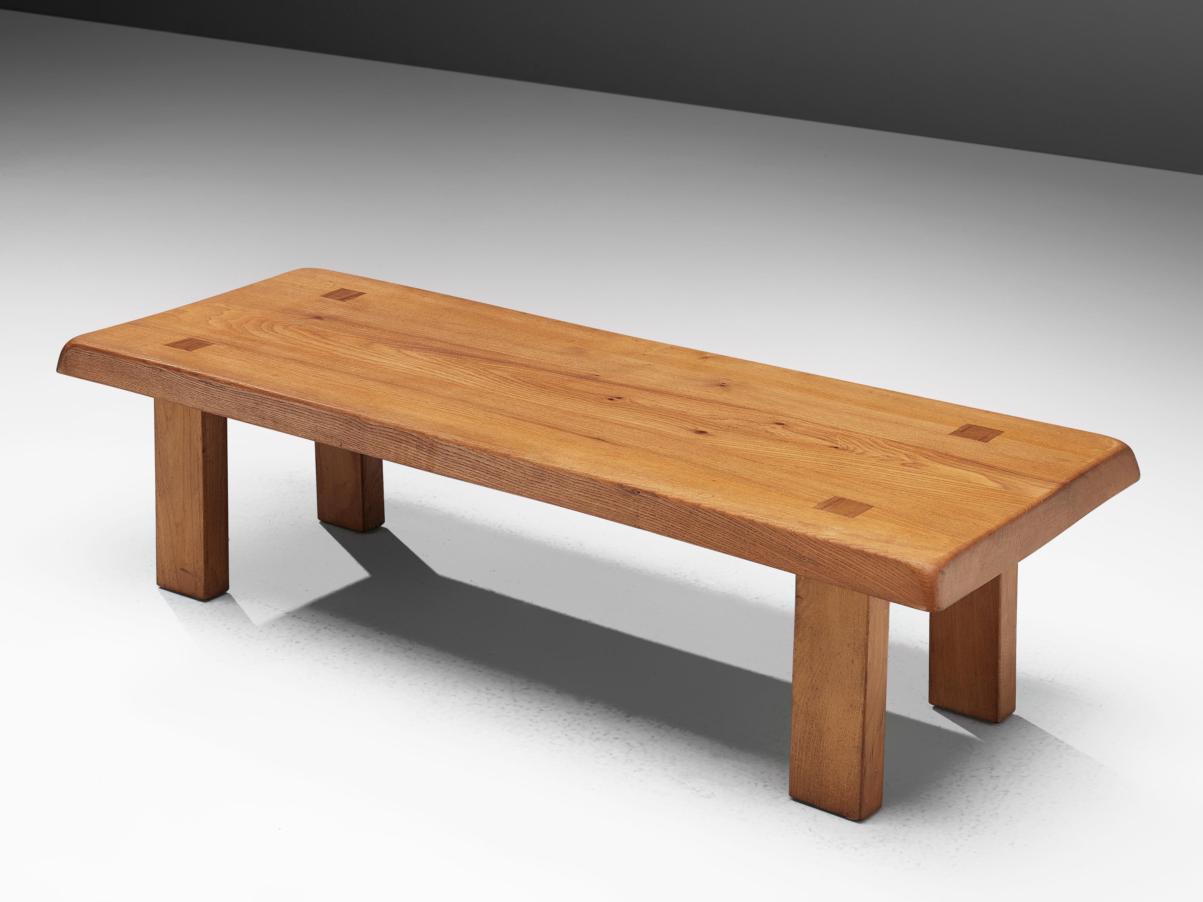 Pierre Chapo, T08 coffee table or bench, solid elm, France, circa 1965.

A rectangular-shaped coffee table by Pierre Chapo from the 1960s. The cocktail table is modest and rationalist in its design. Only decorative detail is the wood connection of