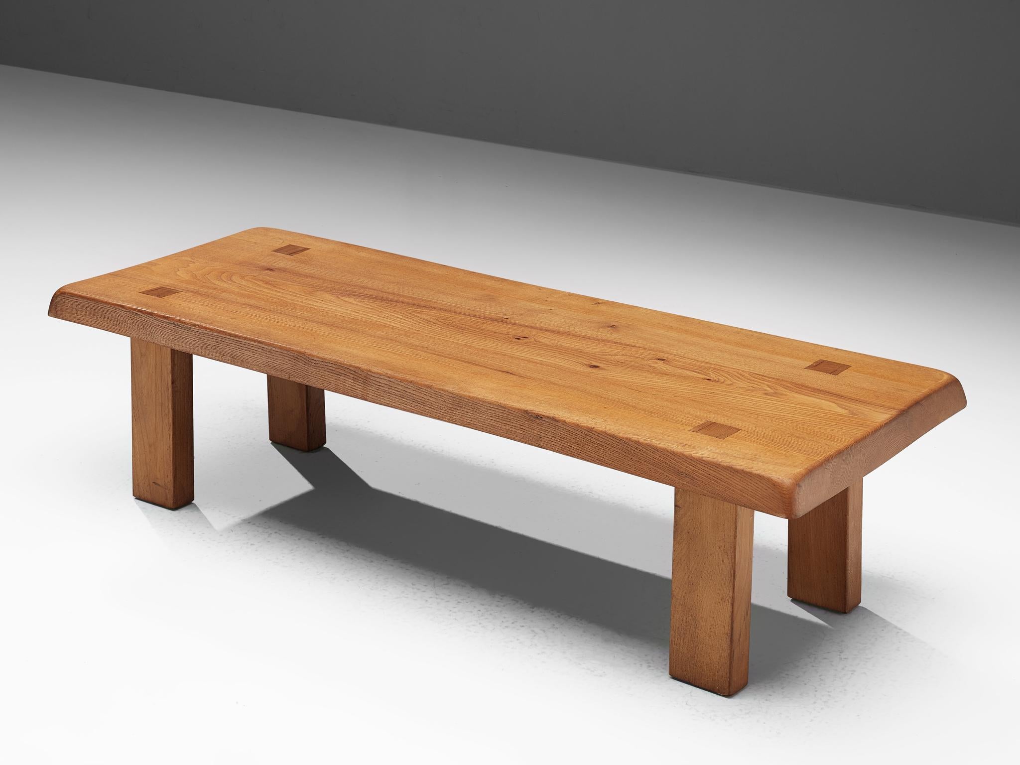 Pierre Chapo, T08 coffee table or bench, solid elm, France, circa 1965.

A rectangular-shaped coffee table by Pierre Chapo from the 1960s. The cocktail table is modest and rationalist in its design. Only decorative detail is the wood connection of