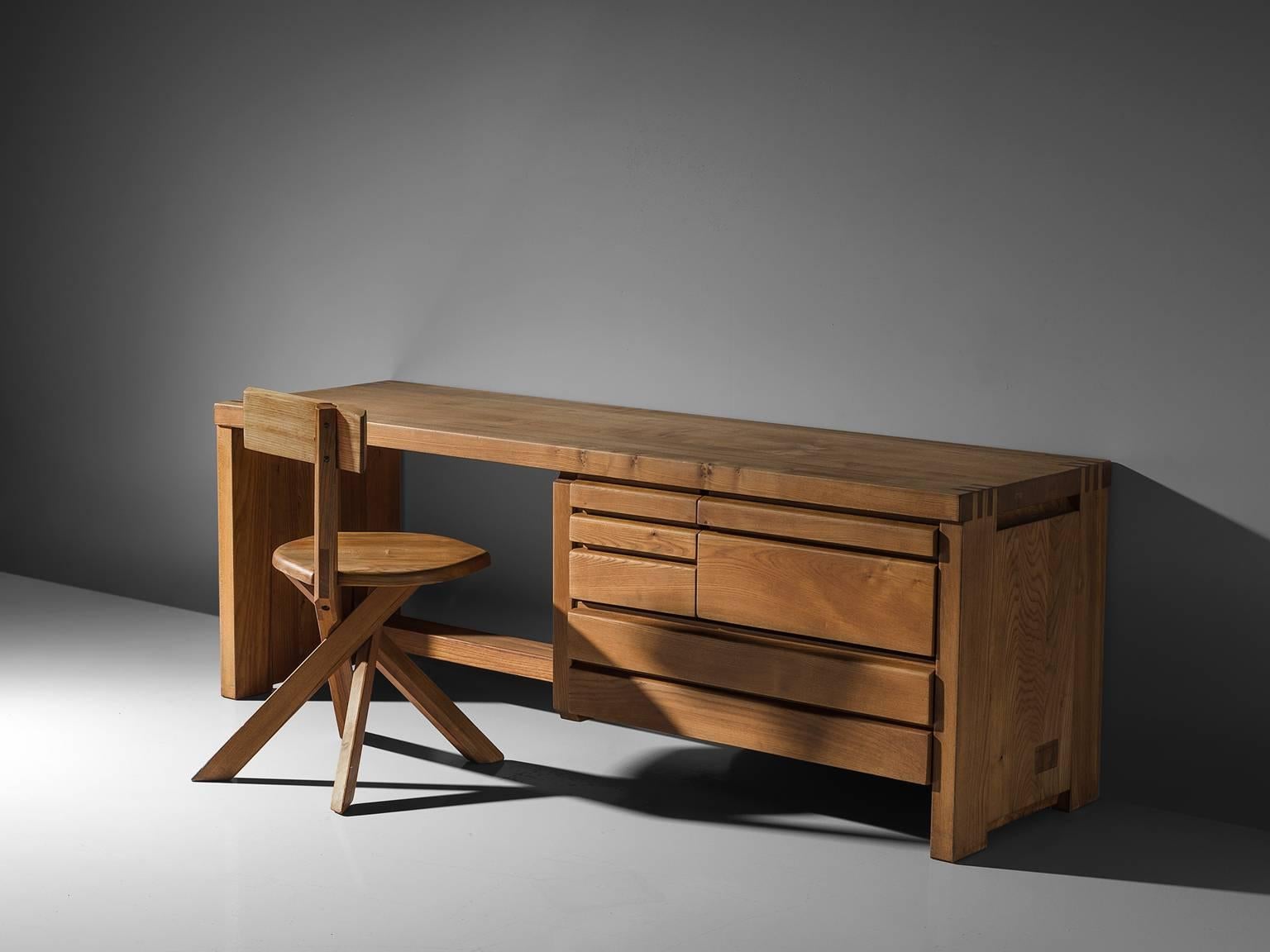 Pierre Chapo, dressing table R05A, elm, ca. 1960.

This exquisitely crafted credenza combines a simplified yet complex design combined with nifty, solid construction details that characterize Chapo's work. The dressing table has seven drawers.