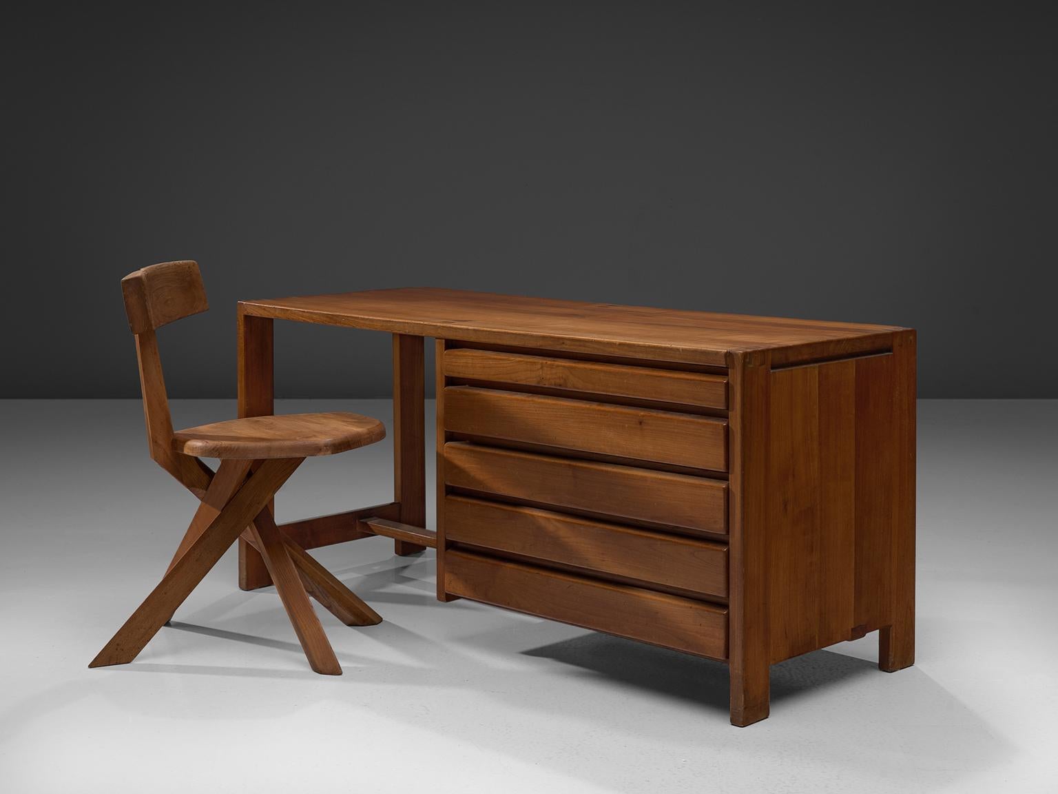 Pierre Chapo, dressing table R05, elm, circa 1960.

This exquisitely crafted credenza combines a simplified yet complex design combined with nifty, solid construction details that characterize Chapo's work. The dressing table has seven drawers.