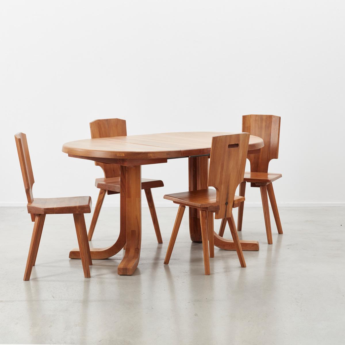 Set of four Pierre Chapo S28 early production dining chairs made from solid elmwood, designed in 1972, produced late 20th century with matching extendable round-to-oval dining table.

The S28 was inspired by Chapo’s travels to Alsace. He wanted to