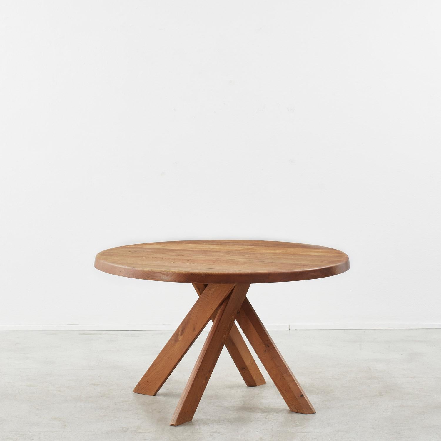 Characterised by its signature twist, this solid elm dining table by French furniture designer and craftsman Pierre Chapo remains one of his most recognisable designs. The dynamic construction hinges on four crossed legs, creating a sturdy but