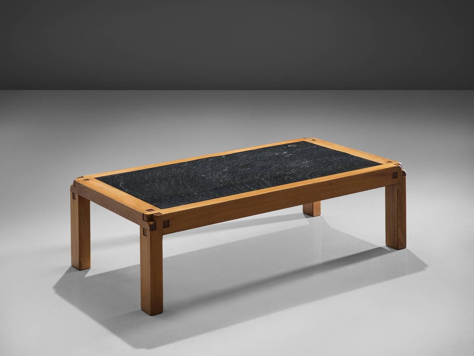 Pierre Chapo, coffee table T18V, elm and enameled lava stone, France, 1960s.

The top of this table is constituted by solid elm and a slab of enamelled lava of a single color. The table is, like many other designs, based on Chapo's 48 x 72