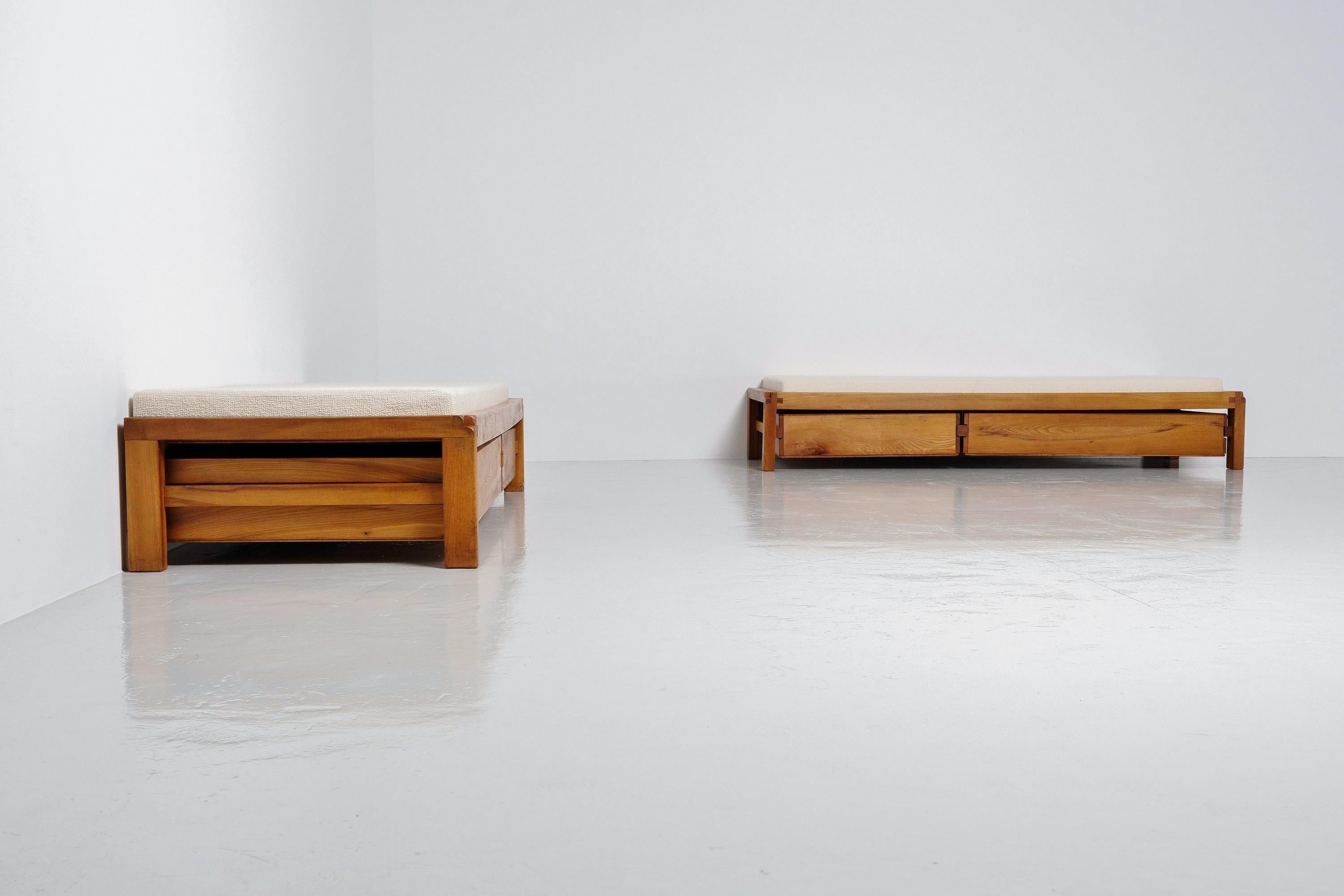 Very distinctive and clean pair of 'Model L03' daybeds designed by Pierre Chapo and manufactured in 1963 in his own workshop. These beds are in a very good and original condition, and have solid elm wooden frames in which his trademark joinery is