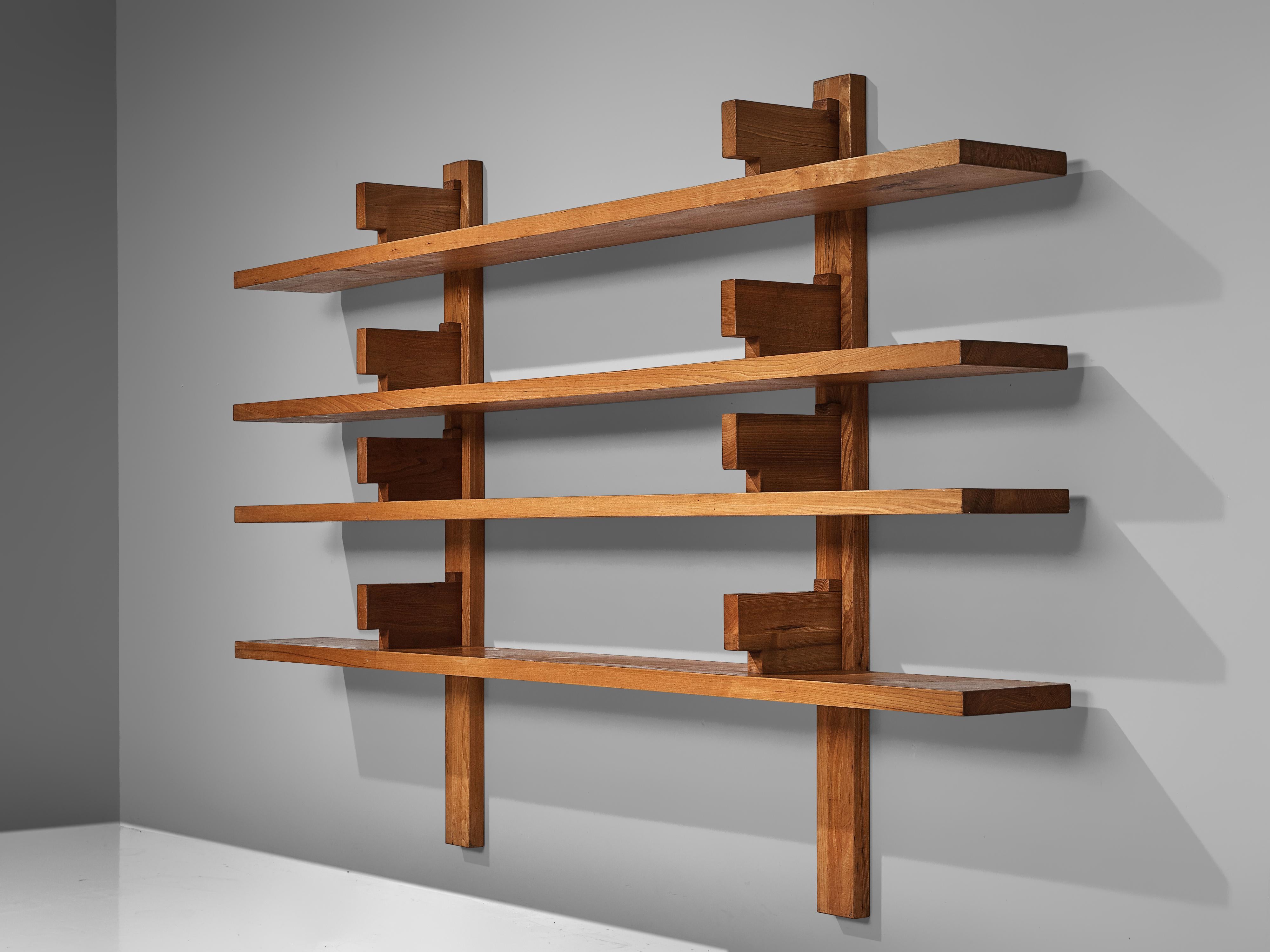 Pierre Chapo, wall unit 'bibliothèque' model B17, elm, France, 1960s

This is a large wall-mounted book shelf model 'B17' designed by Pierre Chapo. It is the largest version of this quintessential piece by Chapo. The shelving system was created in