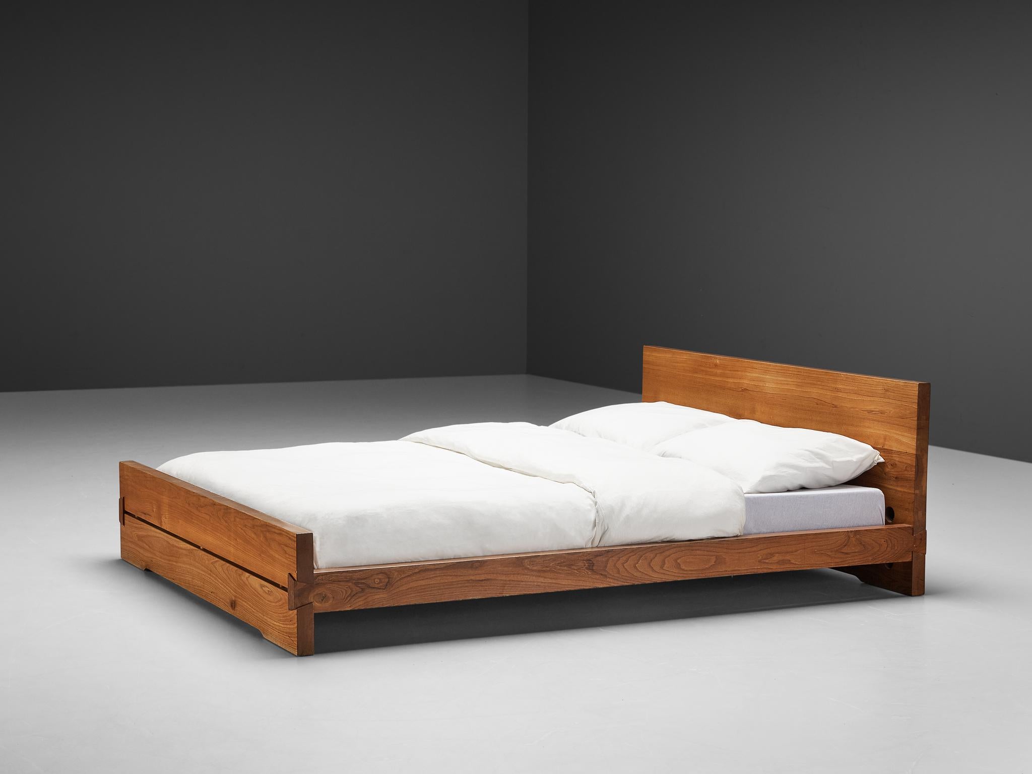 Pierre Chapo, bed 'Louis' L02C, elm, France, 1960s

This bed is designed by Pierre Chapo in the 1960s. It features the handcrafted joints that the woodworker Chapo is known for. The bed holds a tall headboard and a lower foot end. They are