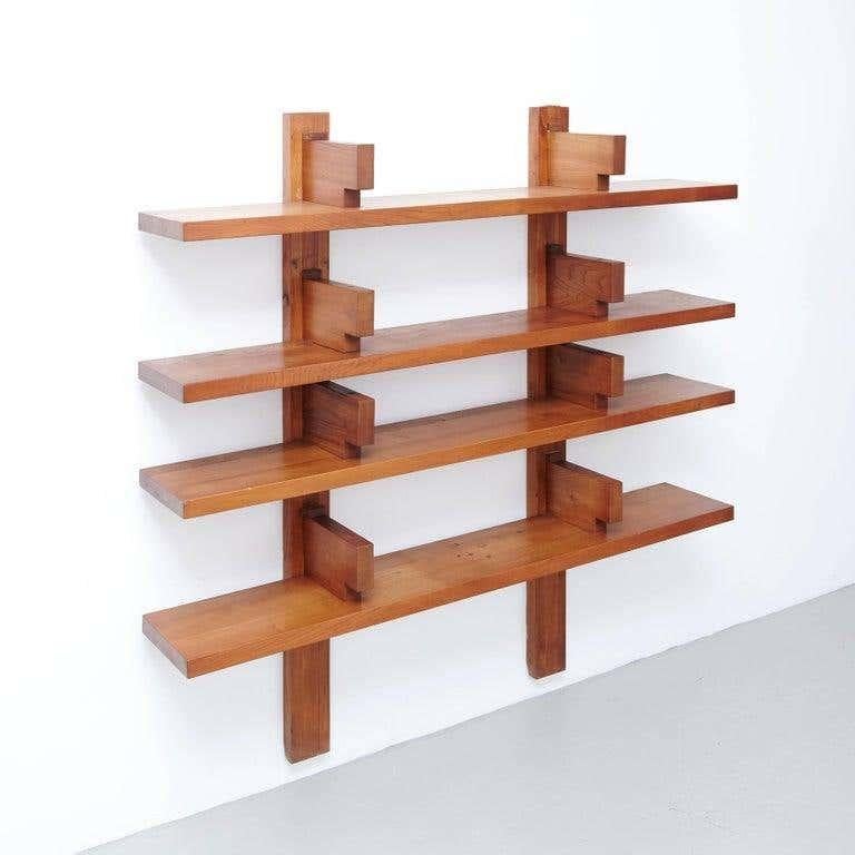 Wall book shelves designed by Pierre Chapo, circa 1960 in France.

Manufactured by Pierre Chapo in Elmwood.

In original condition, with wear consistent with age and use, preserving a beautiful patina.

The lower back part of the wood structure has