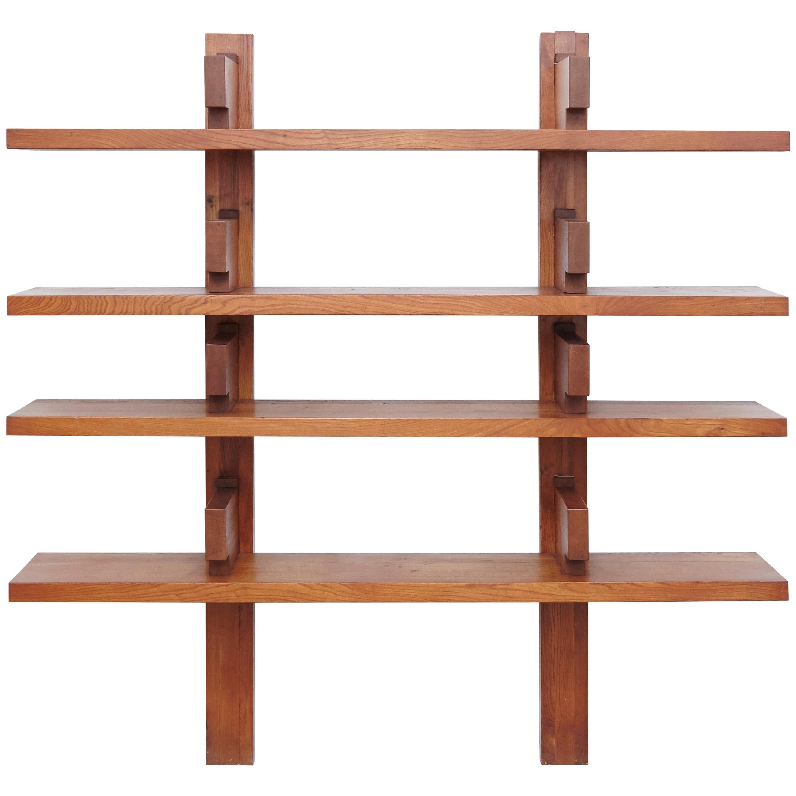 Wall-mounted book shelves designed by Pierre Chapo, circa 1960 in France.

Manufactured by Pierre Chapo in Elmwood

In original condition, with wear consistent with age and use, preserving a beautiful patina.

The lower back part of the wood