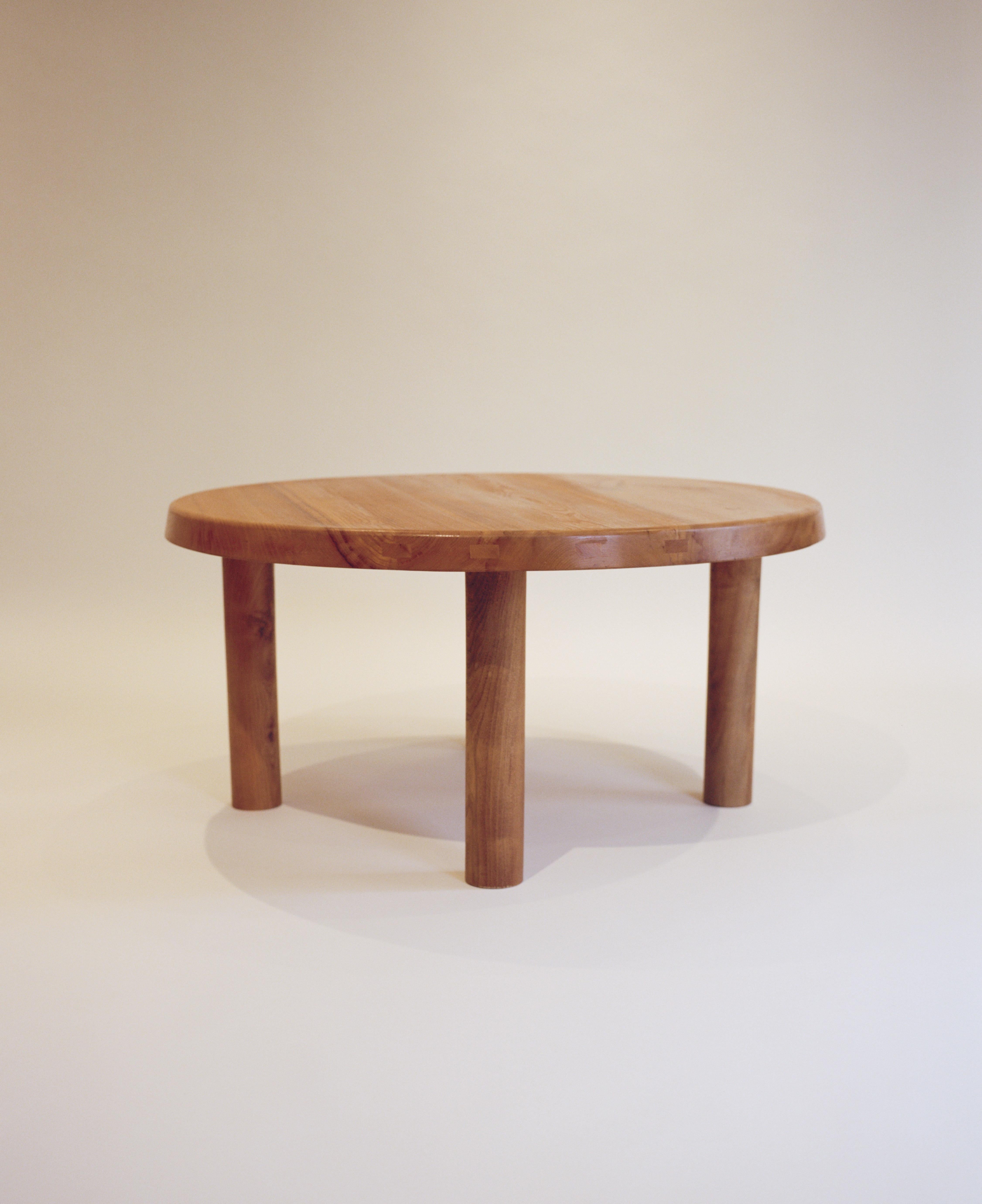 A solid elmwood table by Pierre Chapo designed in the 1960s. Four rounded legs attach to a 2-inch thick top, with beautiful exposed joinery around its edge. An example of Pierre Chapo’s master craftsmanship and consideration of natural materials.