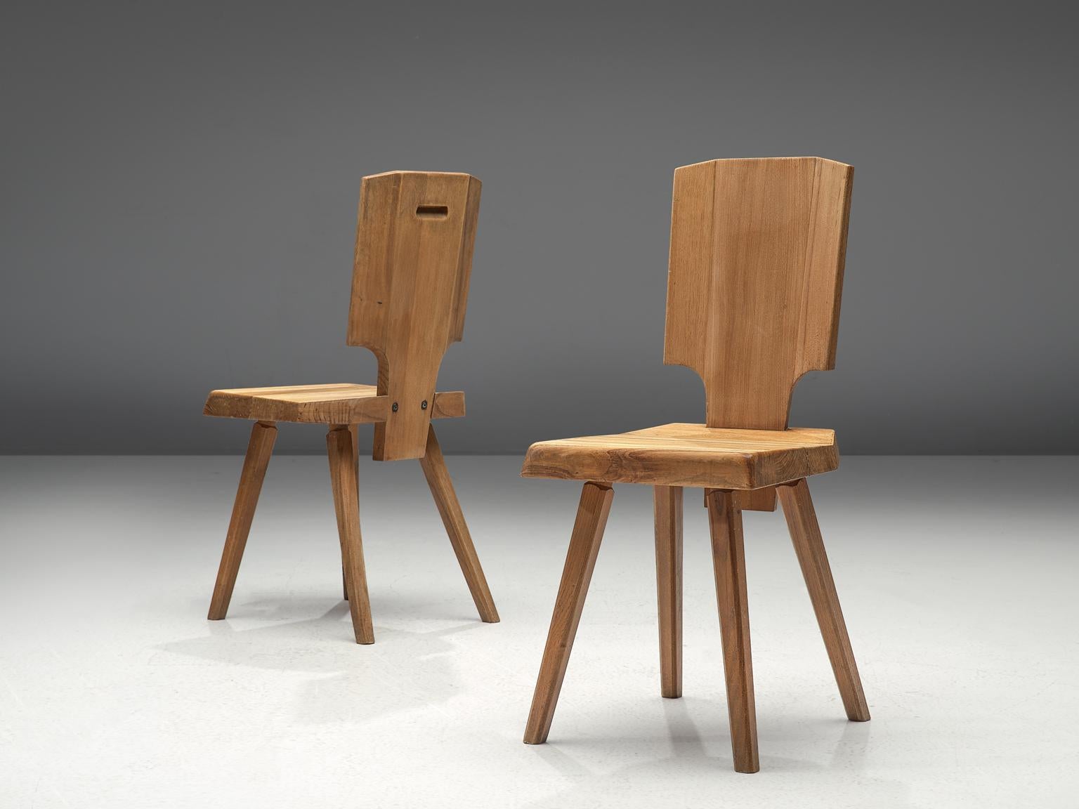 Pierre Chapo, 2 S28 dining chairs, elmwood, France, design 1972, manufactured 1972-1974.

During his travels to Alsace, Chapo discovered the Alsatian architecture and got inspired to modernize the 