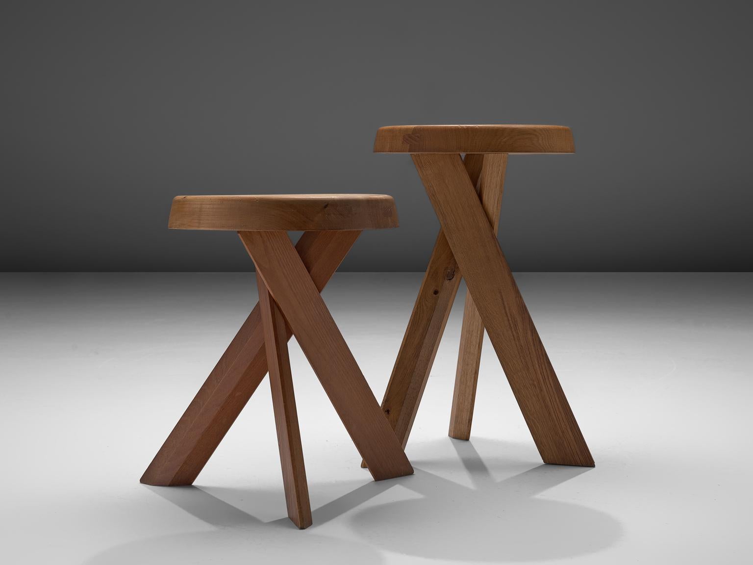 Pierre Chapo, two S31 stools of different heights, elm, France, 1960s.

These asymmetrical stools with twisted legs are an icon of Pierre Chapo's playful and solemn, solid designs. The pieces are made of solid elm and show the characteristics of