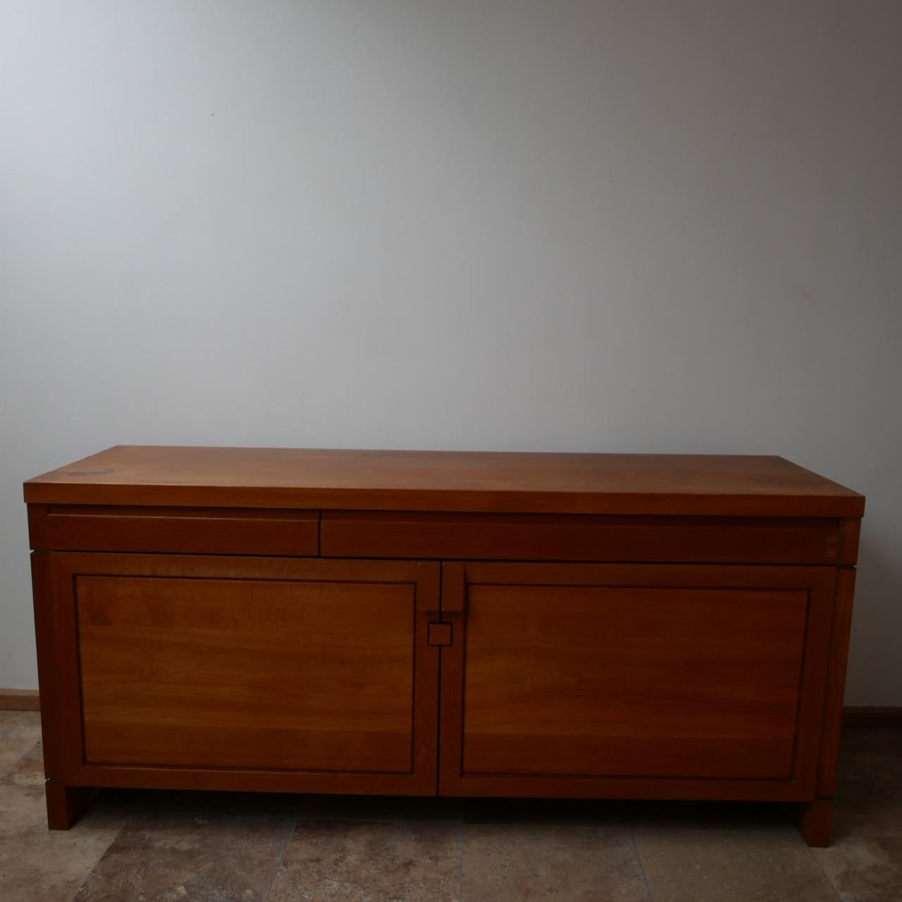 A sideboard by legendary French designer, Pierre Chapo.

Immense quality of materials and construction.

Normally formed from elm, this one is an earlier oak model.

Two drawers, two doors.

Dimensions: 52.5 depth x 84 height x 182.5 width