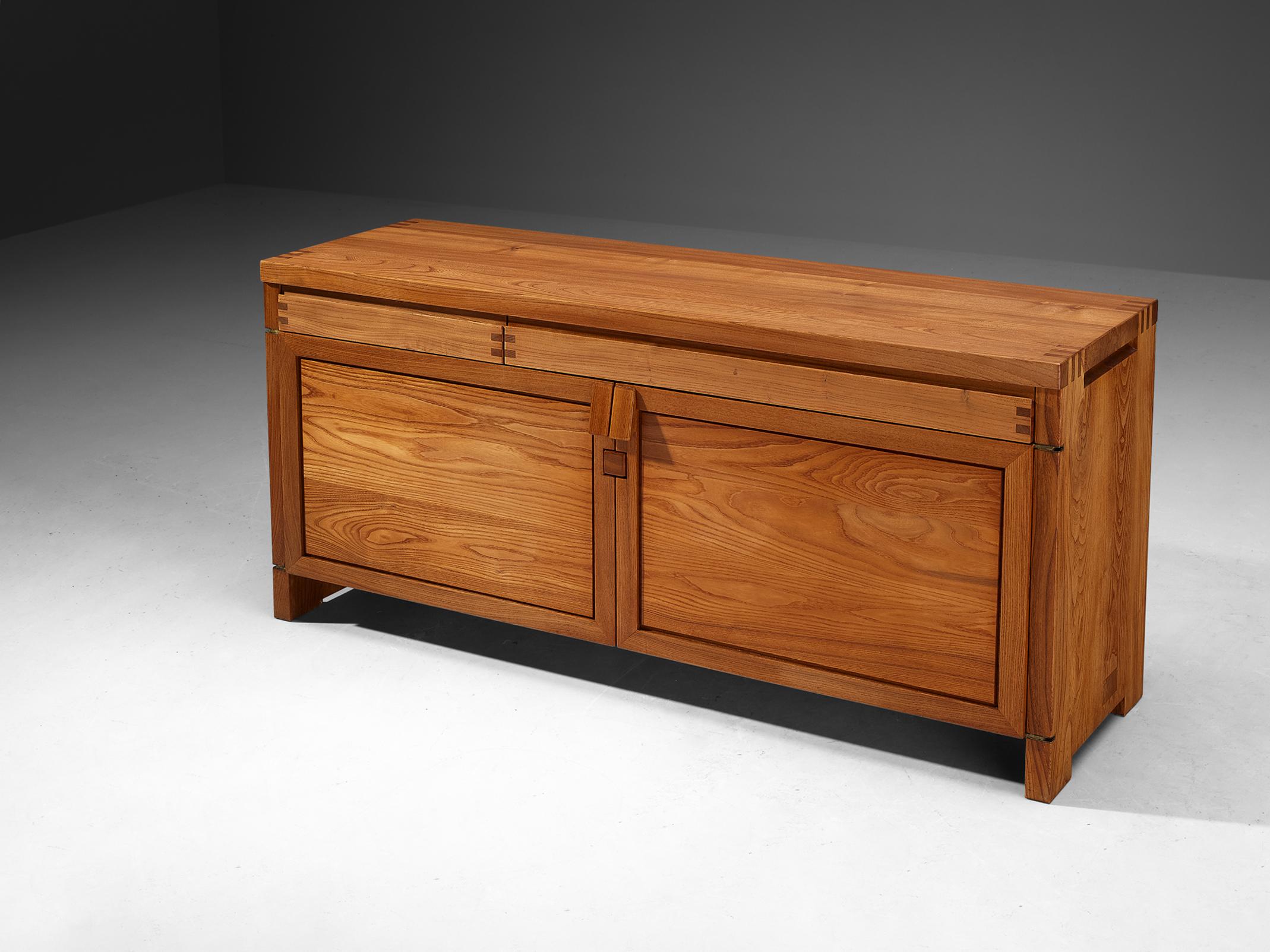 Pierre Chapo, sideboard, model 'R08', elm, France, circa 1964.

This R08 cabinet is one of the early editions designed by Pierre Chapo, known for his hallmark use of solid elmwood and a commitment to pure and clean design and construction