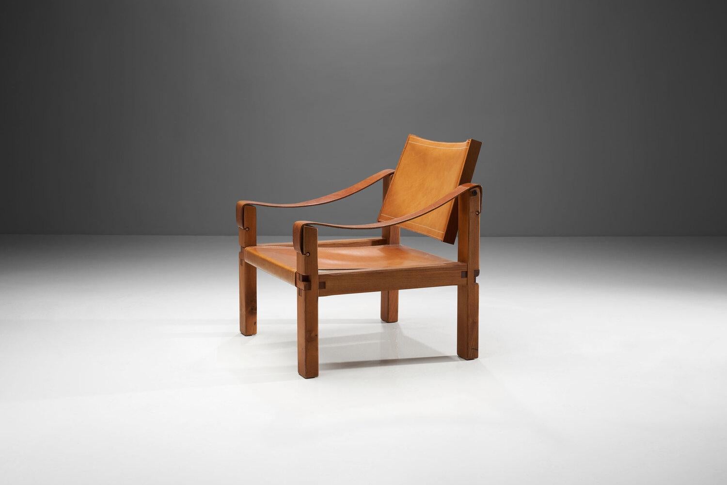 Designed in the 1960s and produced in solid elm and cognac leather, the 