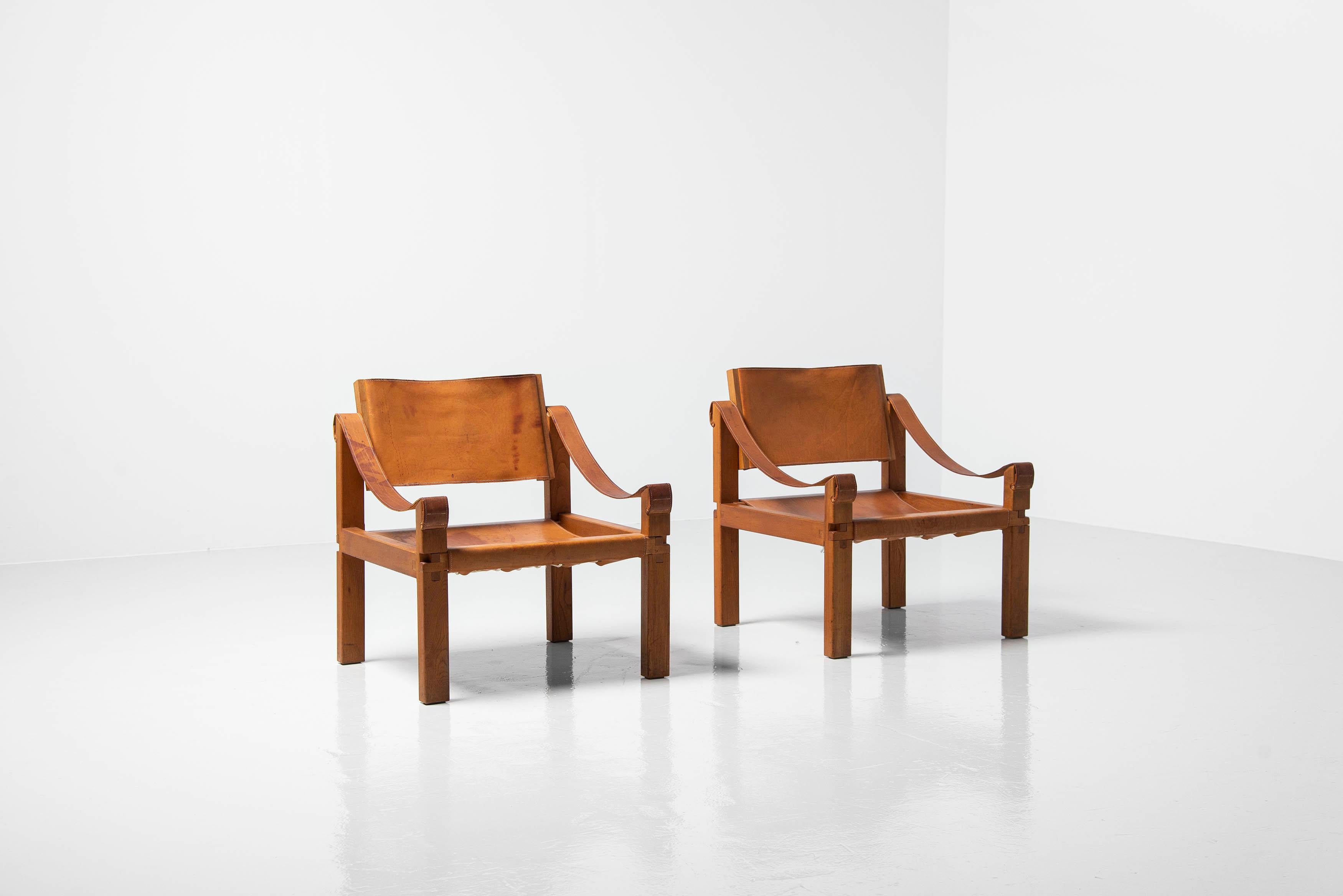 Stunning pair of S10 lounge chairs designed by Pierre Chapo and manufactured in his own atelier in France, 1964. These chairs have a solid elm wooden frame which has an exquisite detailed structure which is refined with his trademark mortise and