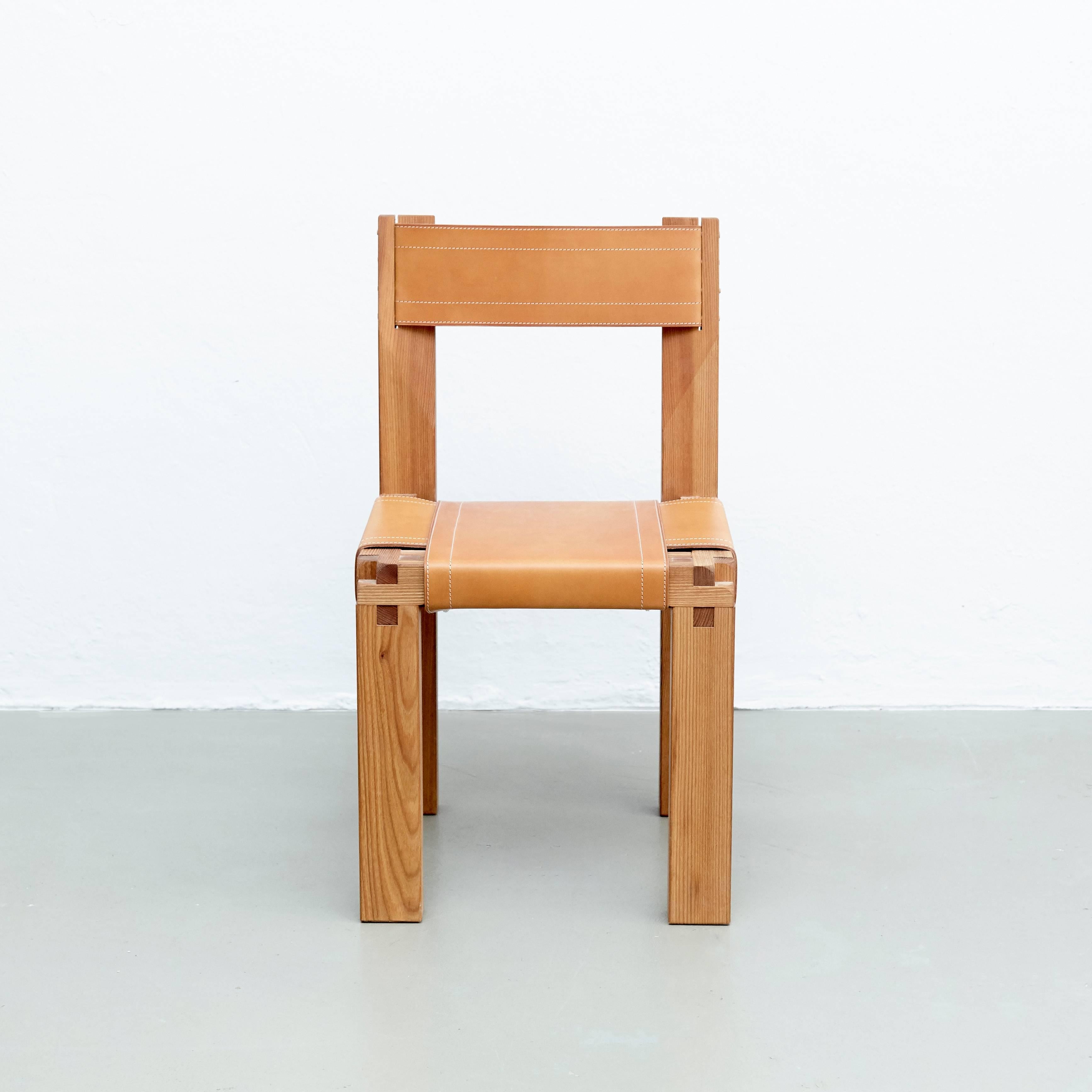 S 11 chair designed by Pierre Chapo, circa 1960.
Manufactured by Chapo Creation in France, 2016.
Solid elm, seat stretched in thick leather.

In good original condition, with minor wear consistent with age and use, preserving a beautiful