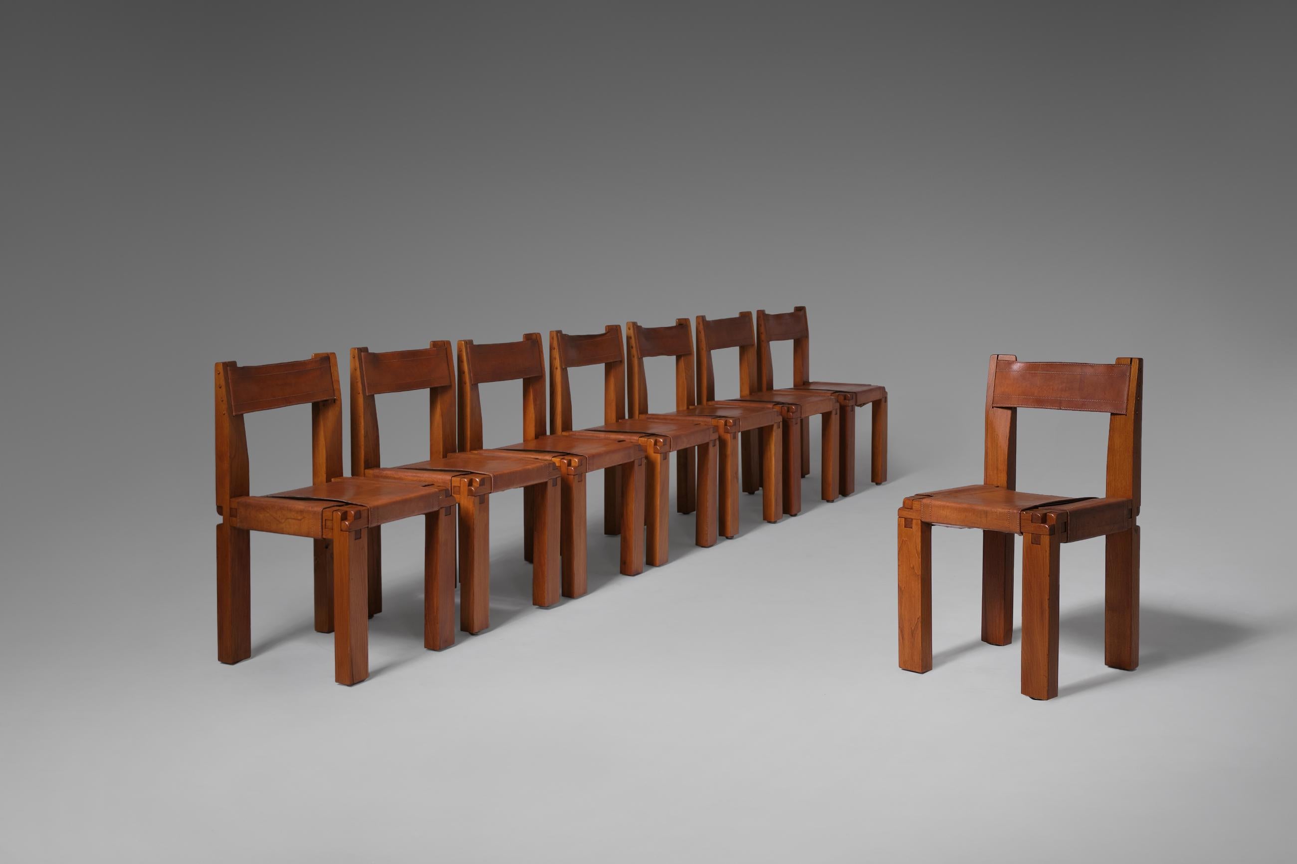 Stunning set of eight ‘S11’ dining chairs by Pierre Chapo, France 1966. Made of solid elmwood with beautifully patinated cognac saddle leather seating and back rest. The well crafted 